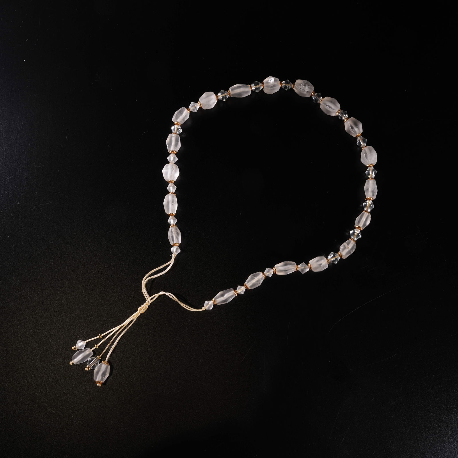 A ROCK CRYSTAL CARVED PENDANT: Rock crystal carved pendant