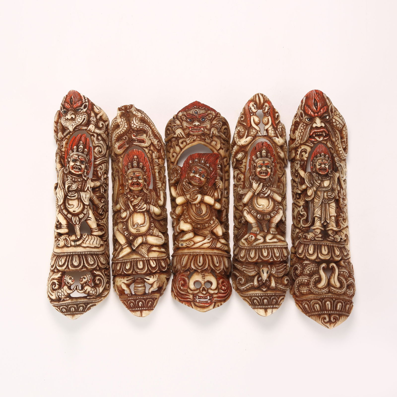 A A GROUP OF BONE-CARVED DHARMAPALA ROBE FRAGMENTS: A Group of Bone-Carved Dharmapala Robe Fragments