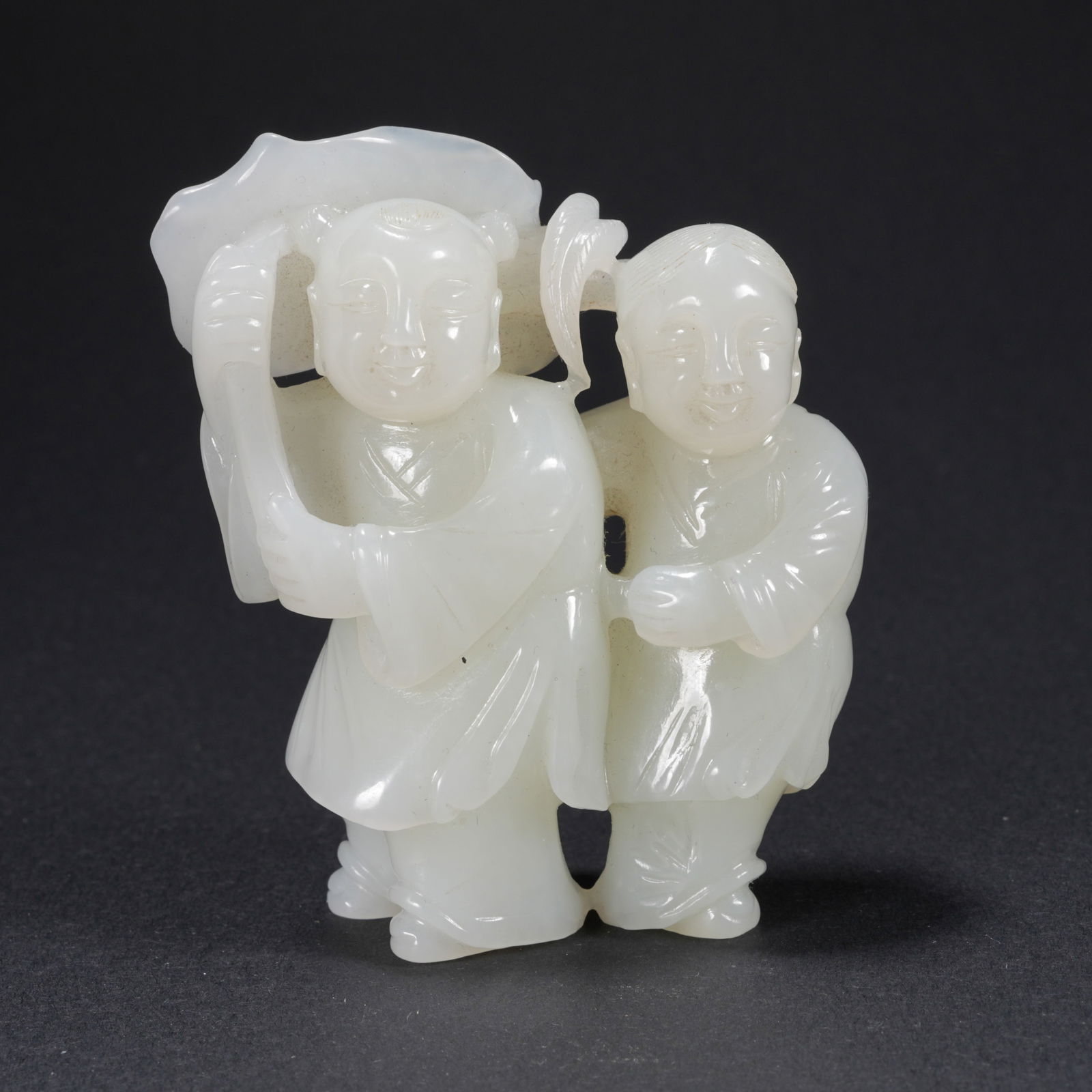 A HETIAN JADE CARVED TWO BOYS BRINGING BLESSINGS FIGURE: Hetian Jade Carved Two Boys Bringing Blessings Figure