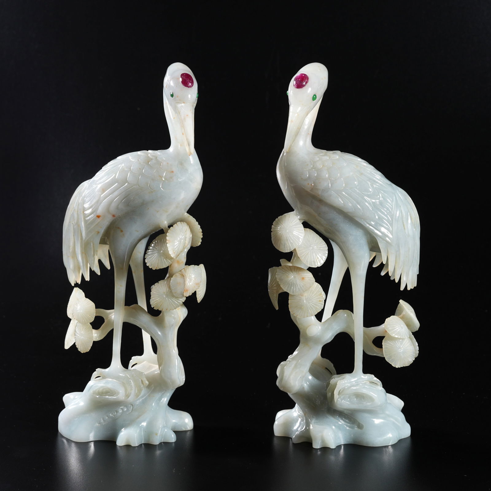A PAIR OF JADEITE CARVED PINE-AND-CRANE ORNAMENTS: Pair of Jadeite Carved Pine-and-Crane Ornaments