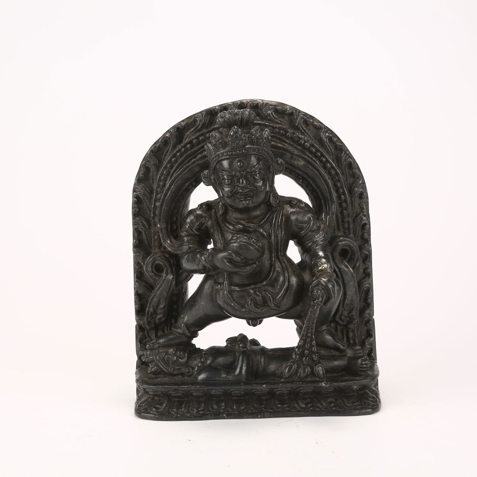 A FIGURE OF BLACK JAMBHALA IN BLACK STONE: Figure of Black Jambhala in Black Stone