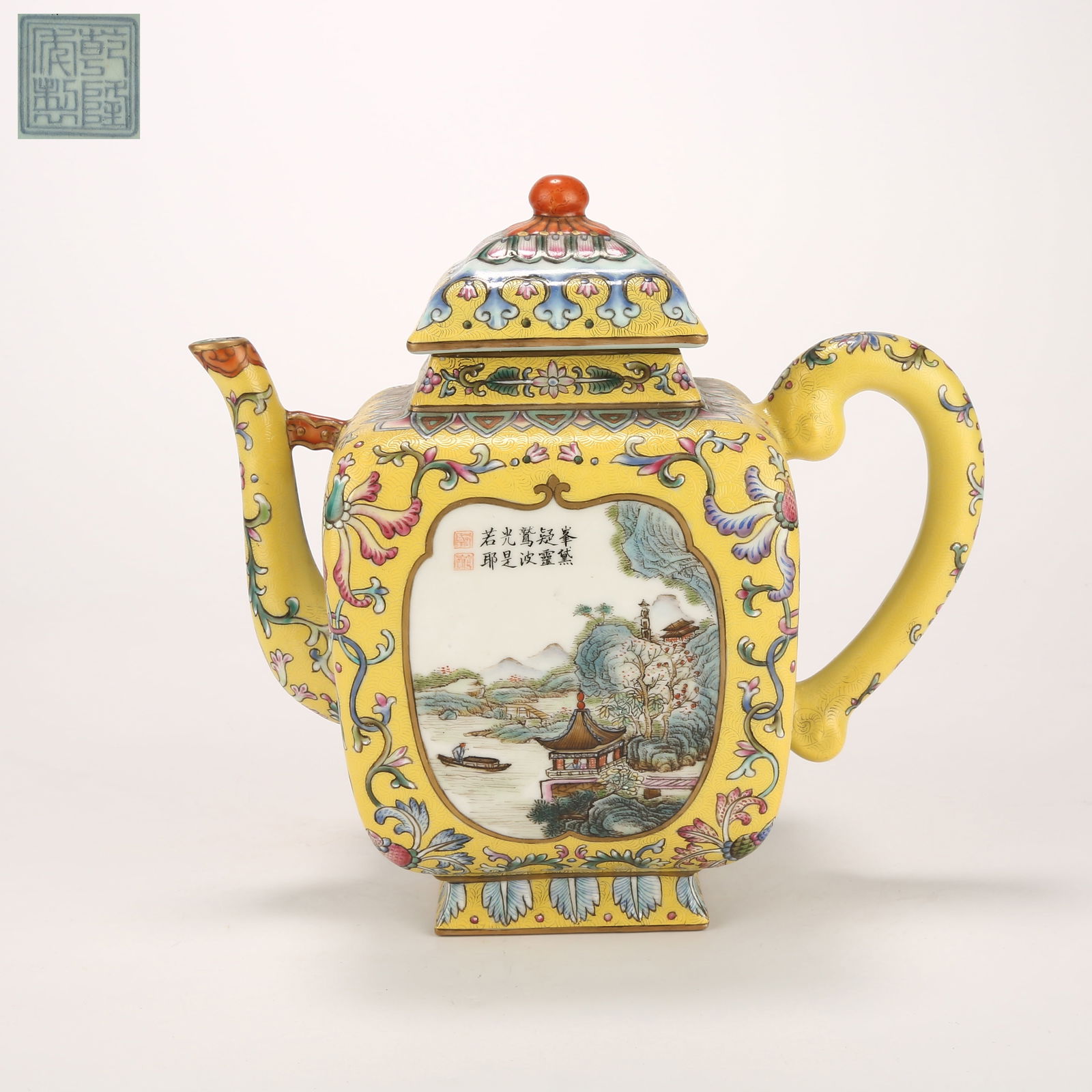 A YELLOW-GROUND INCISED EWER WITH FAMILLE-ROSE LANDSCAPE PANELS: Yellow-ground incised ewer with famille-rose landscape panels