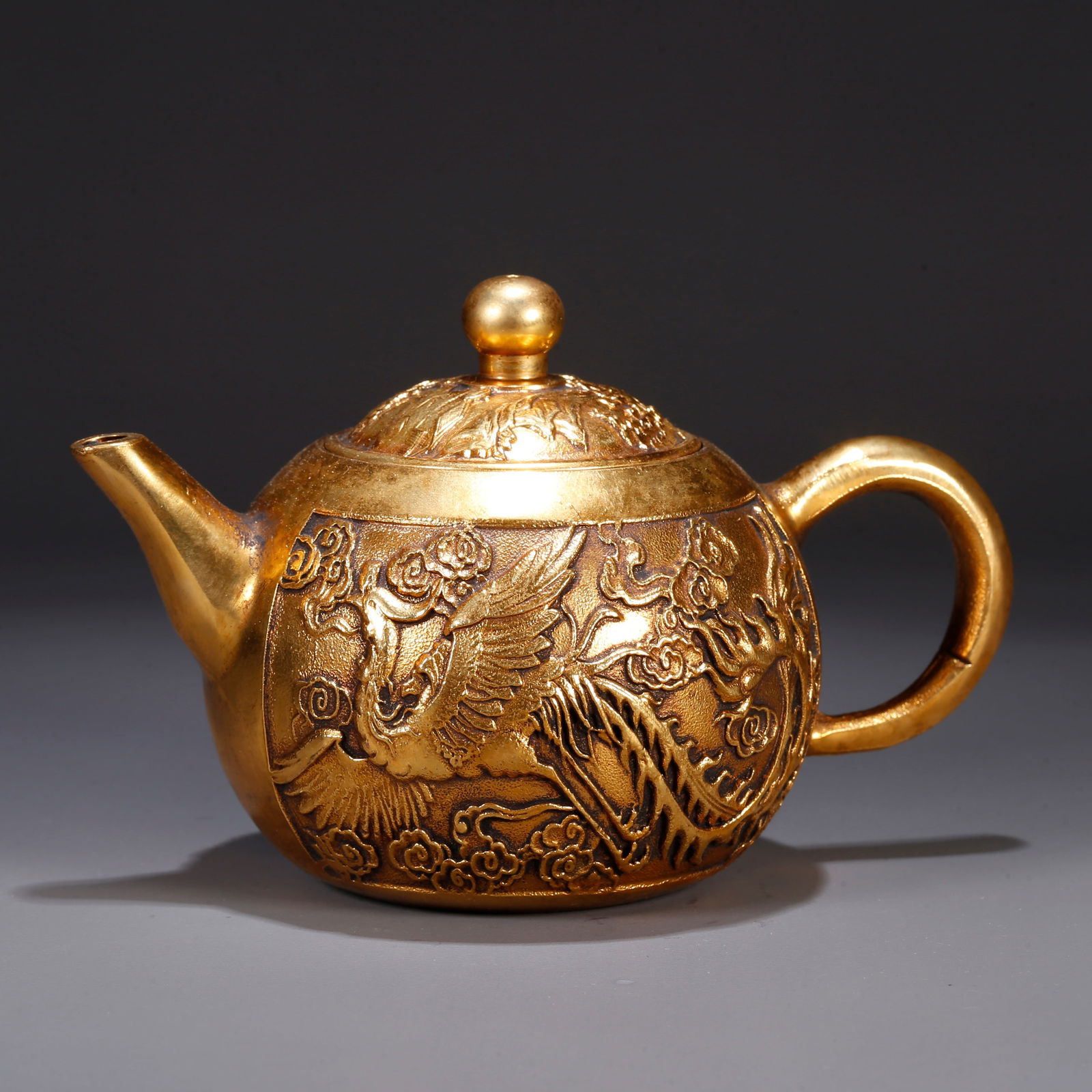 A GILT BRONZE EWER WITH DRAGON AND PHOENIX MOTIFS (1 of 9)