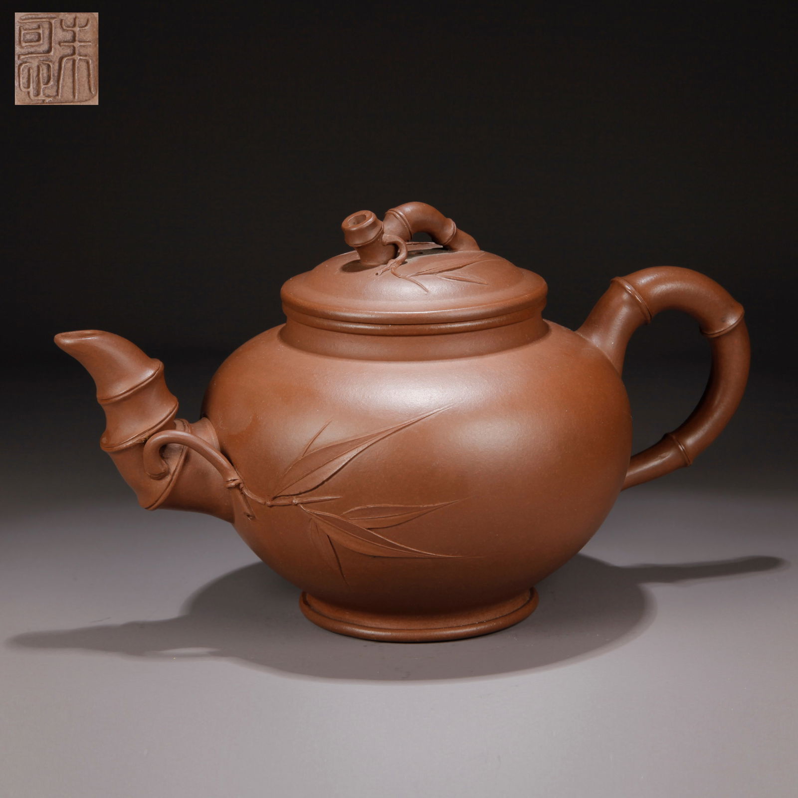 A ZISHA CLAY EWER WITH CARVED BAMBOO KNOB: Zisha Clay Ewer with Carved Bamboo Knob