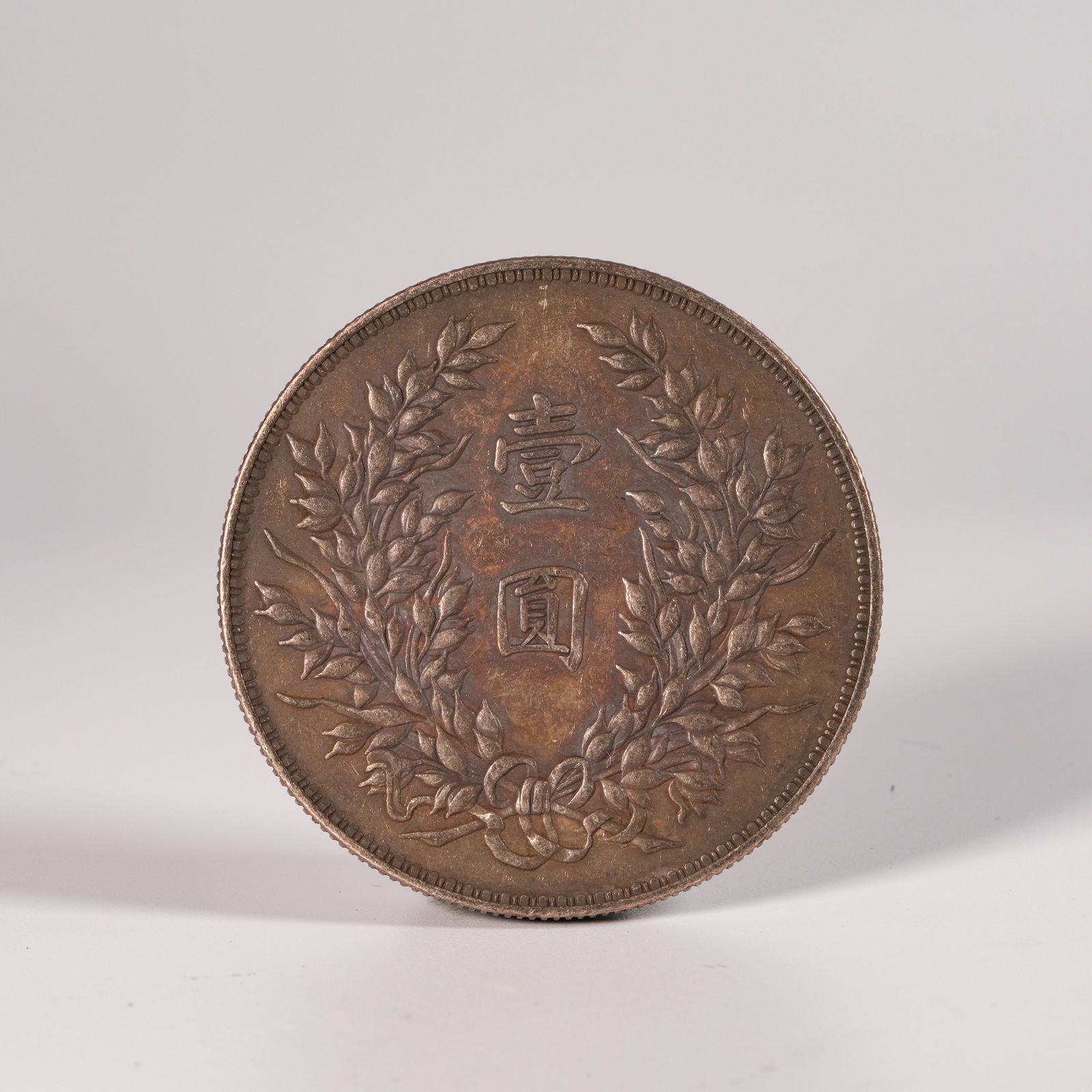 A SILVER DOLLAR COIN (1 of 3)