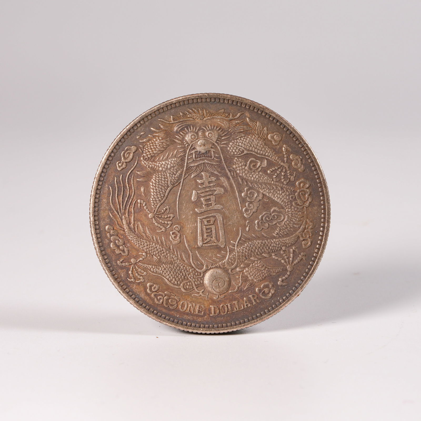 A SILVER DOLLAR COIN (1 of 3)