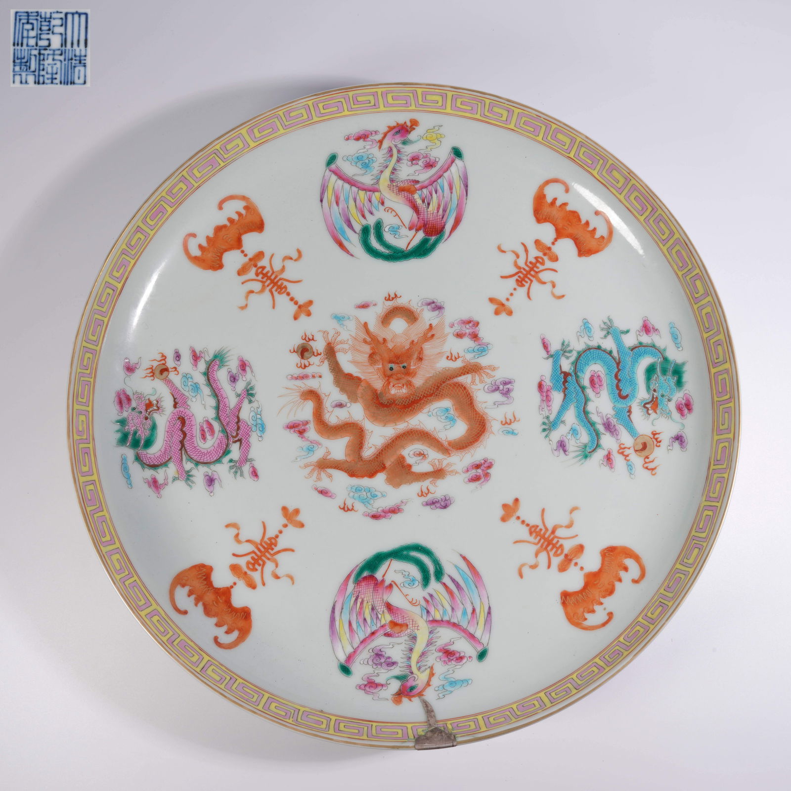 A WUCAI IRON-RED DRAGON-AND-PHOENIX PLATE (WITH RESTORATION) (1 of 9)