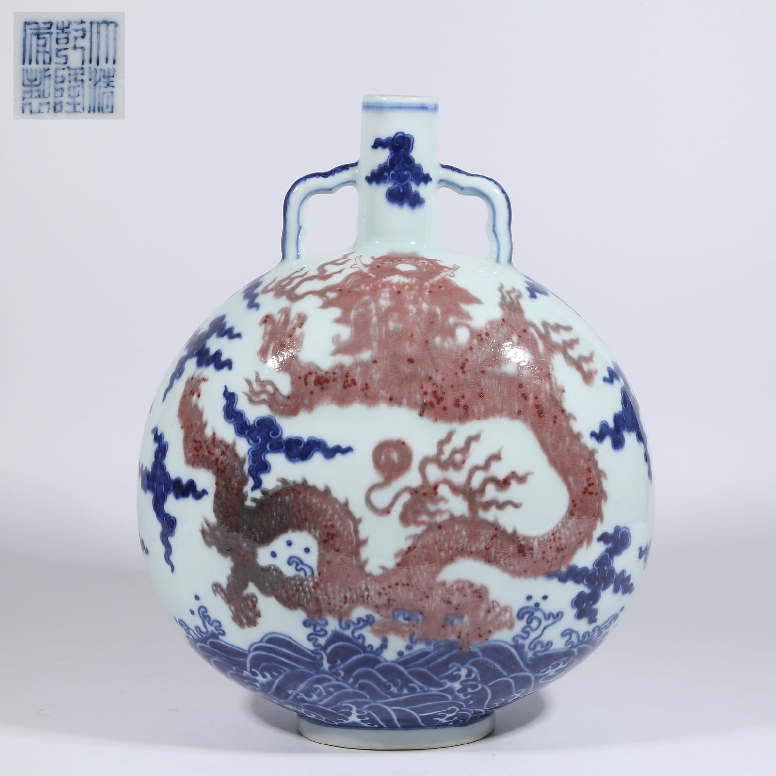 A BLUE AND WHITE WITH UNDERGLAZE RED RUYI-HANDLED VASE WITH DRAGON AMID WAVES DESIGN (1 of 9)