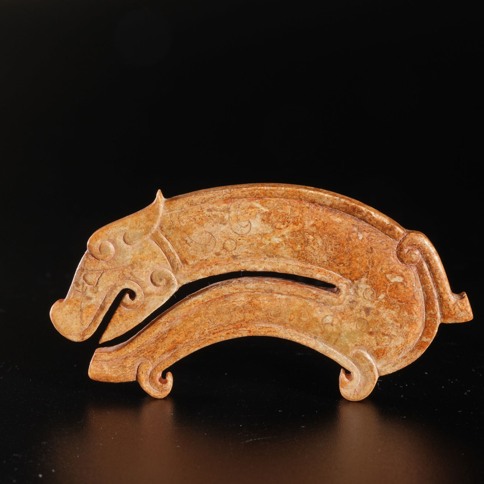 A ARCHAIC JADE ZOOMORPHIC PENDANT (1 of 10)