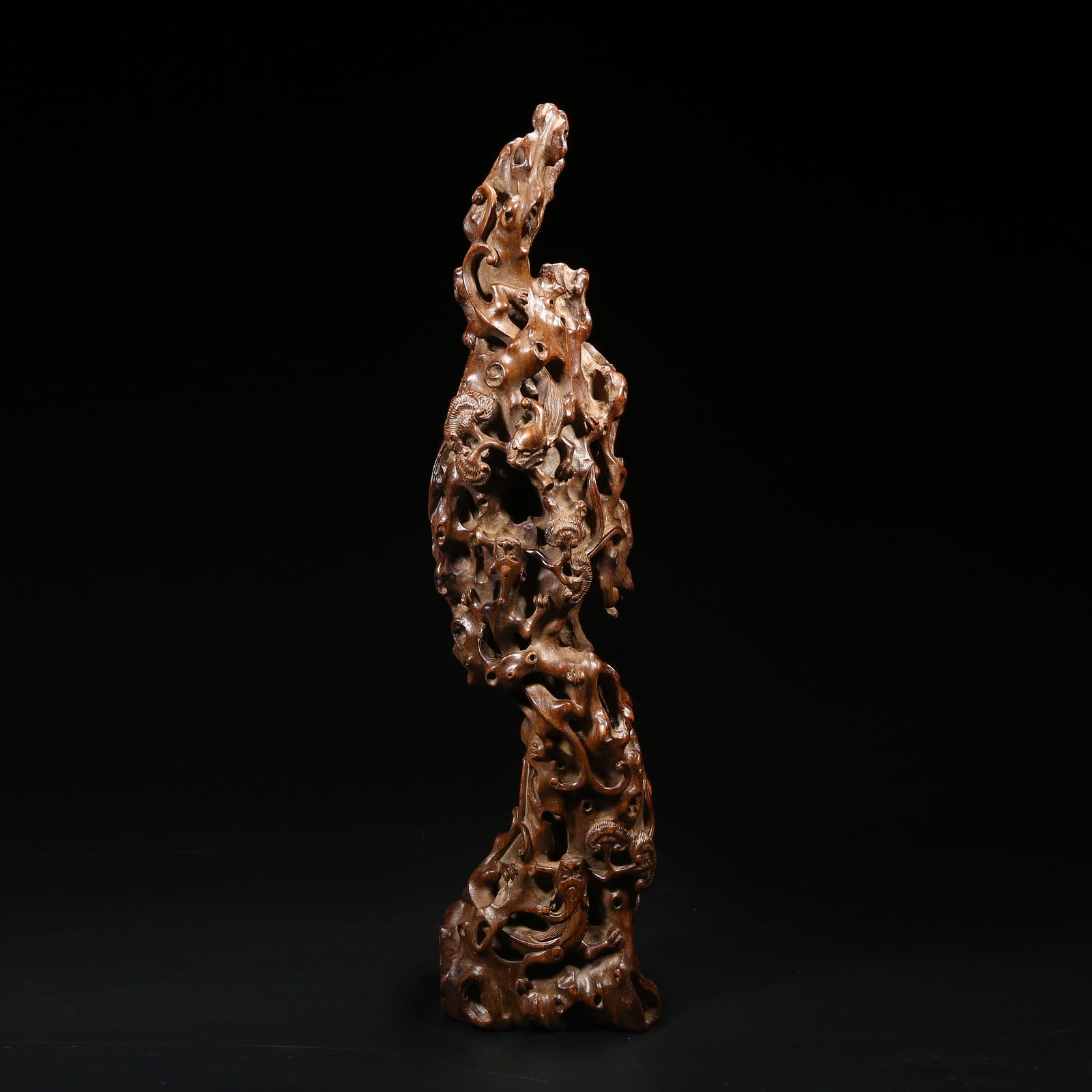 A HUANGHUALI MOUNTAIN-SHAPED CARVING WITH CHI DRAGON AND CHI PHOENIX MOTIFS: Huanghuali mountain-shaped carving with chi dragon and chi phoenix motifs