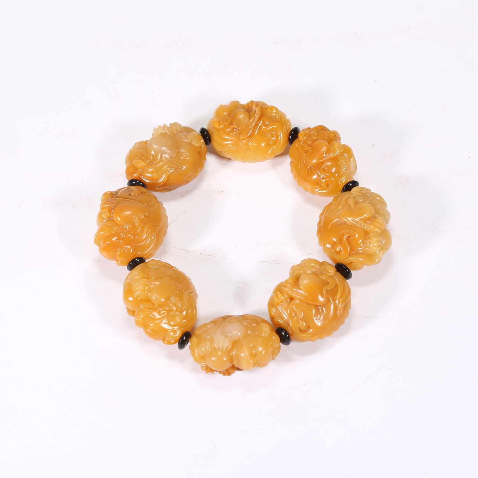 A SHOUSHAN STONE CARVED HAND STRING: Shoushan stone carved hand string