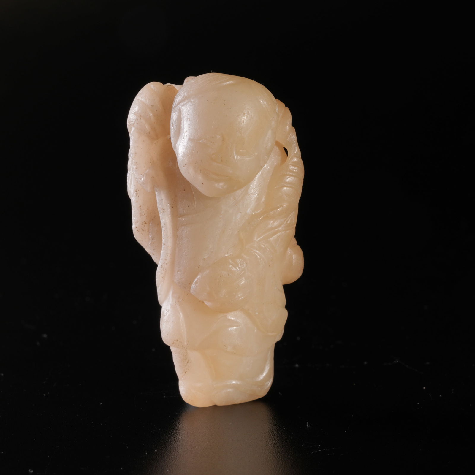 A HETIAN JADE CARVED BOY-FORM DISPLAY PIECE (1 of 9)