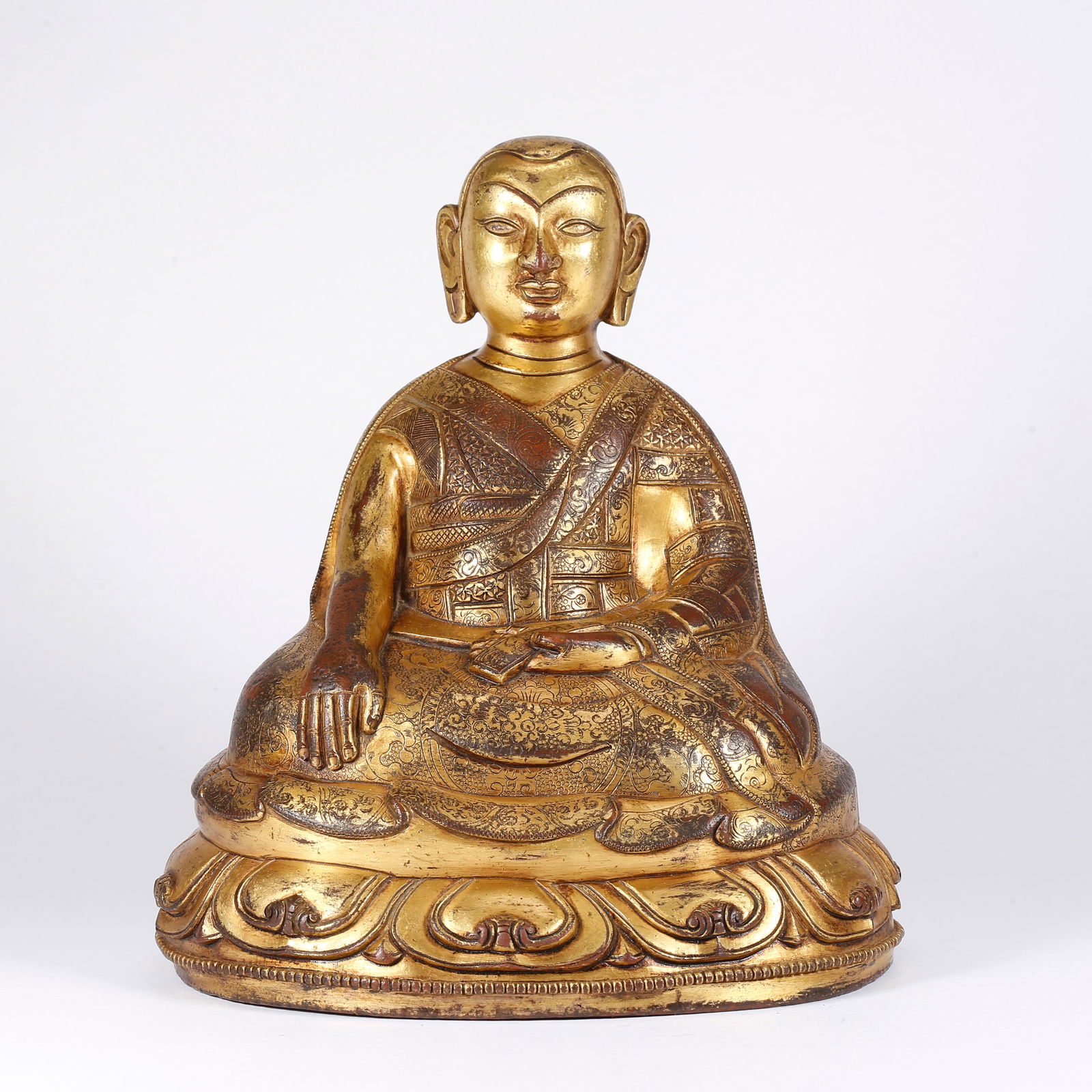 A GILT BRONZE LAMA STATUE: Gilt Bronze Lama Statue
