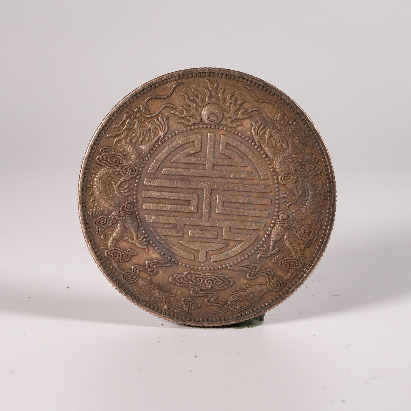 A SILVER DOLLAR COIN - 3