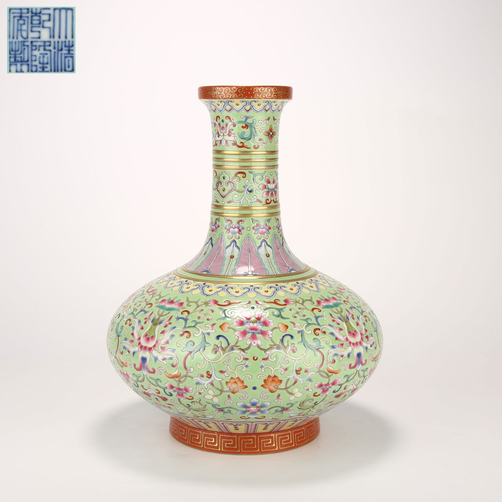 A GREEN-GROUND FAMILLE-ROSE VASE WITH ENTWINED FLORAL AND STRING PATTERN AND FLARED MOUTH: Green-ground famille-rose vase with entwined floral and string pattern and flared mouth