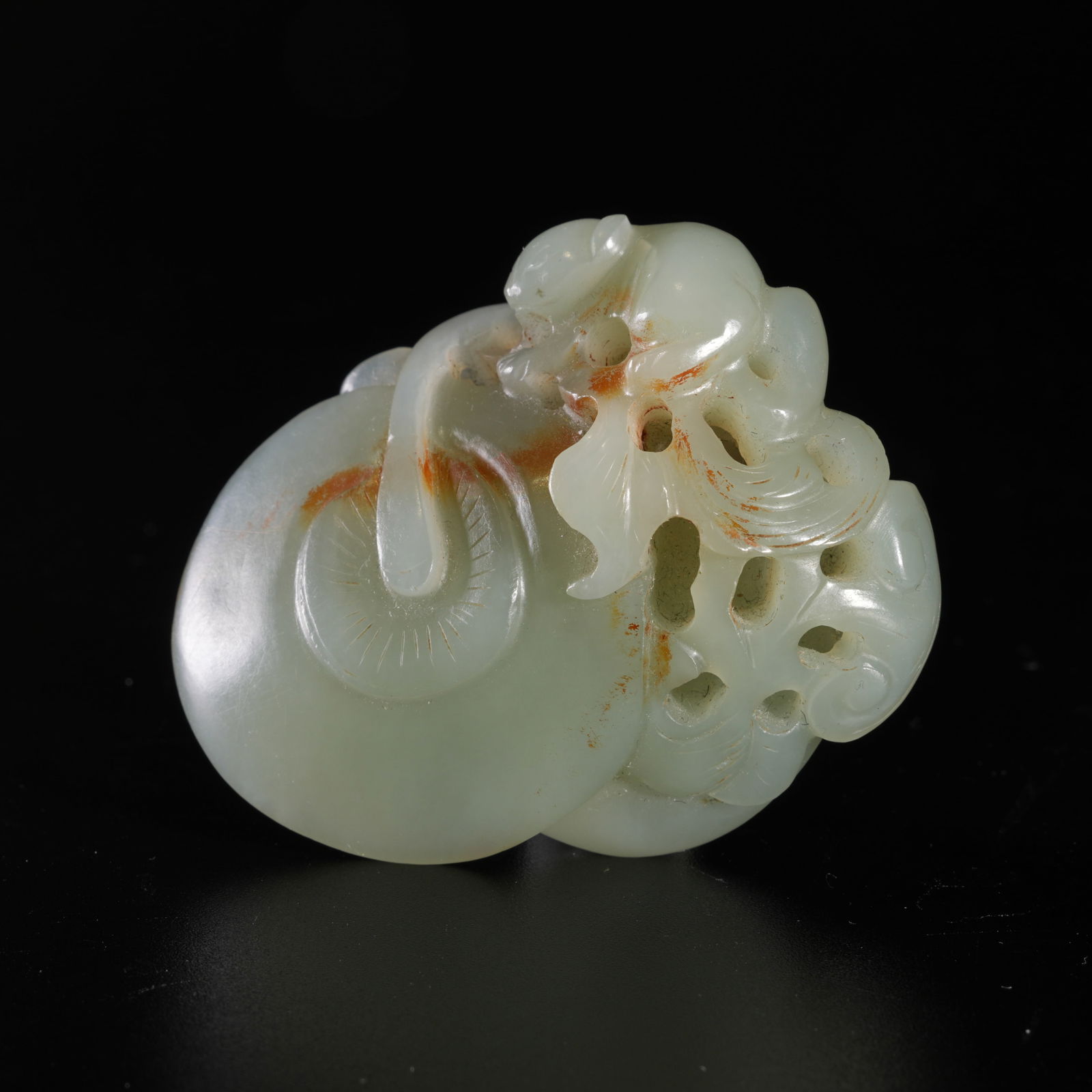 A HETIAN JADE CARVED PENDANT: Hetian jade carved pendant
