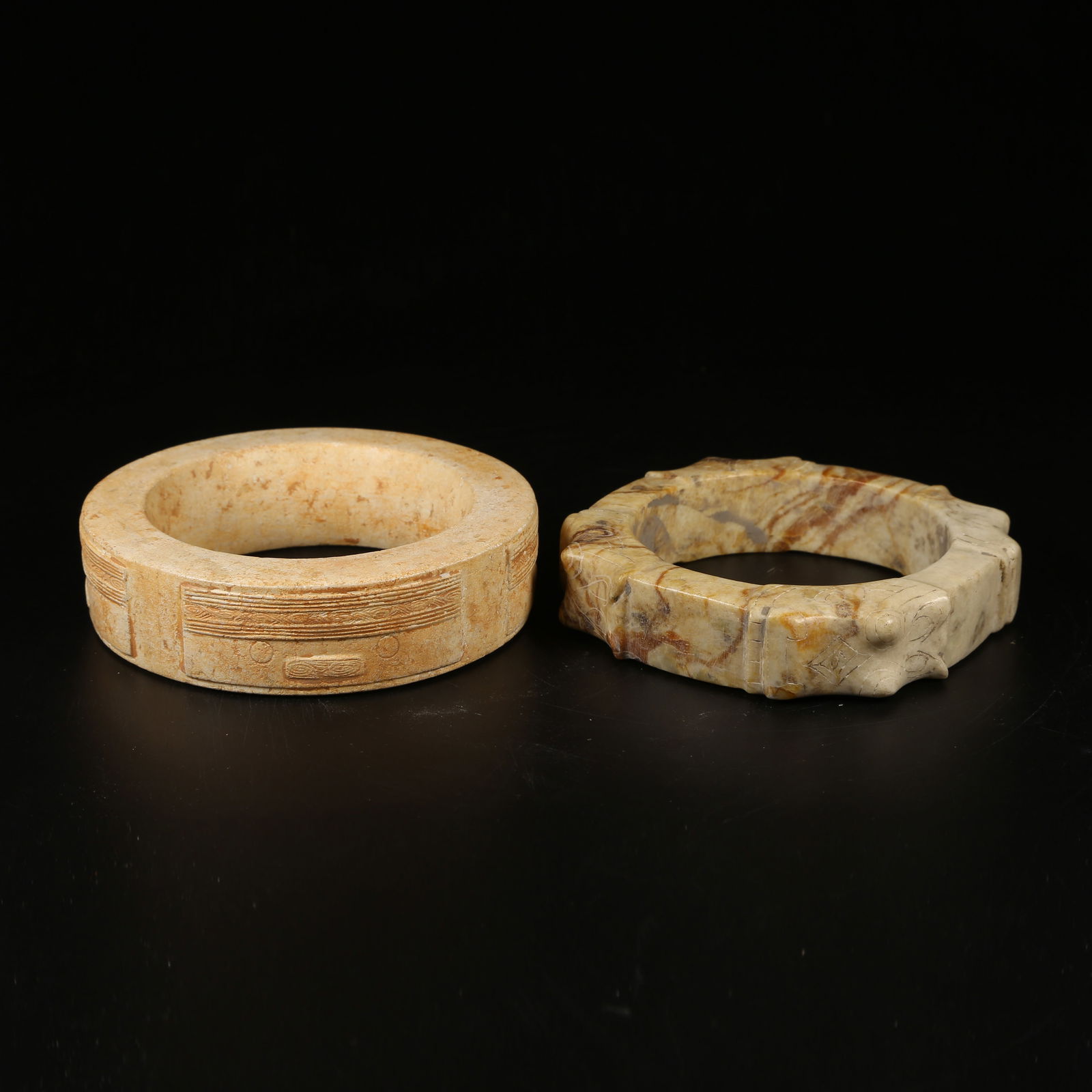 A SET OF ANCIENT JADE LIANGZHU CULTURE ANTHROPOMORPHIC FACE RINGS (1 of 10)