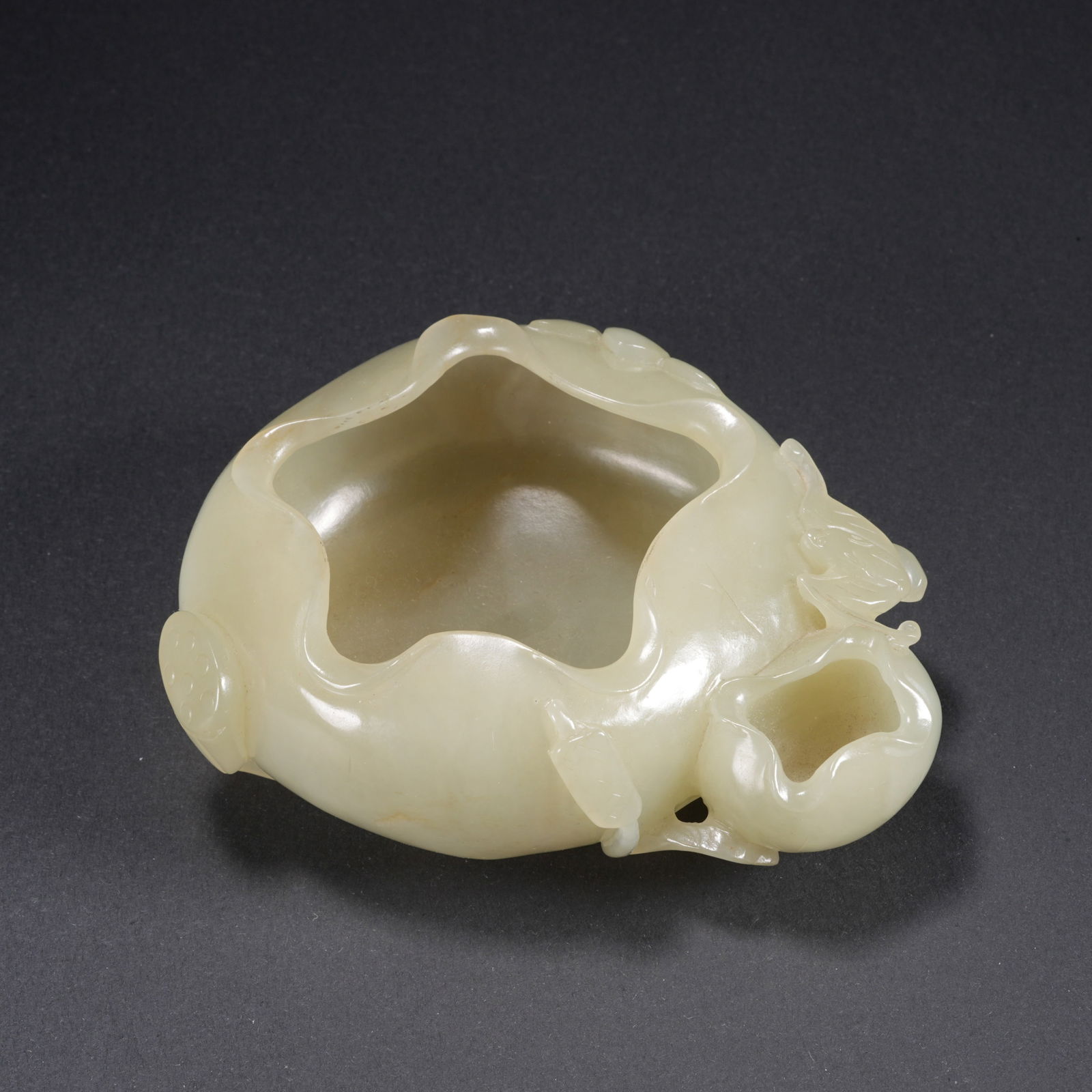 A HETIAN JADE CARVED LOTUS-FORM WASH BASIN: Hetian Jade Carved Lotus-Form Wash Basin