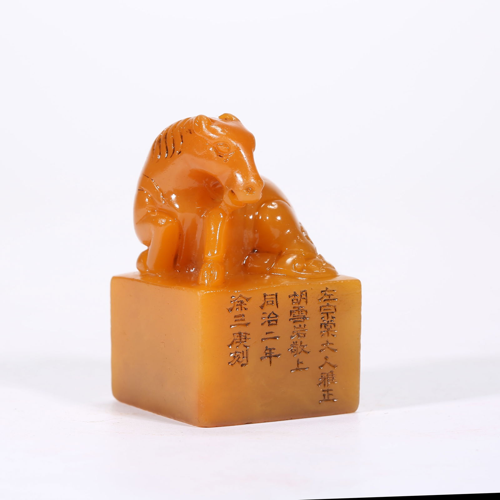 A SHOUSHAN TIANHUANG STONE SEAL WITH HORSE FINIAL: Shoushan Tianhuang stone seal with horse finial