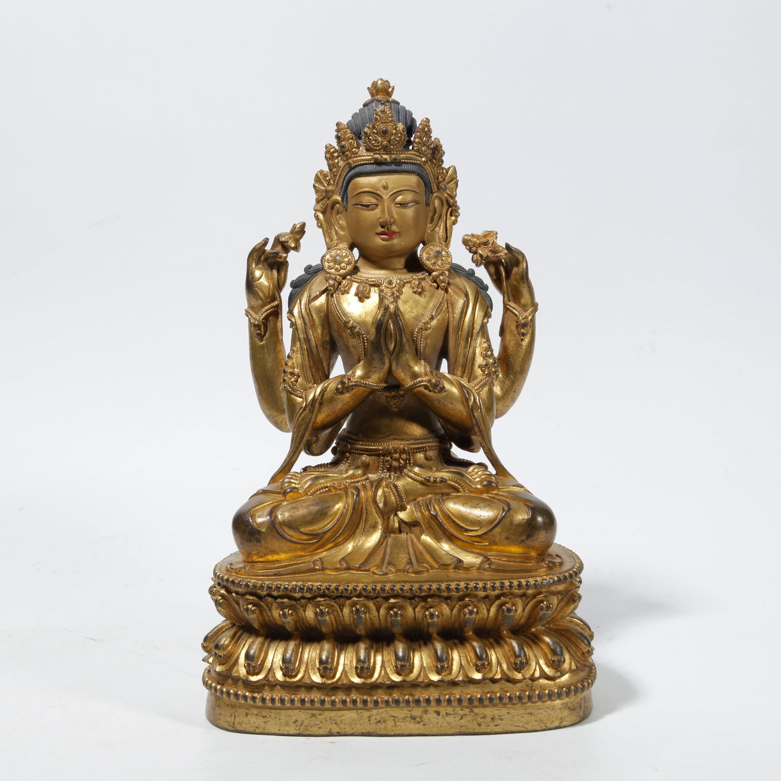 A GILT BRONZE FOUR-ARMED GUANYIN STATUE (1 of 9)