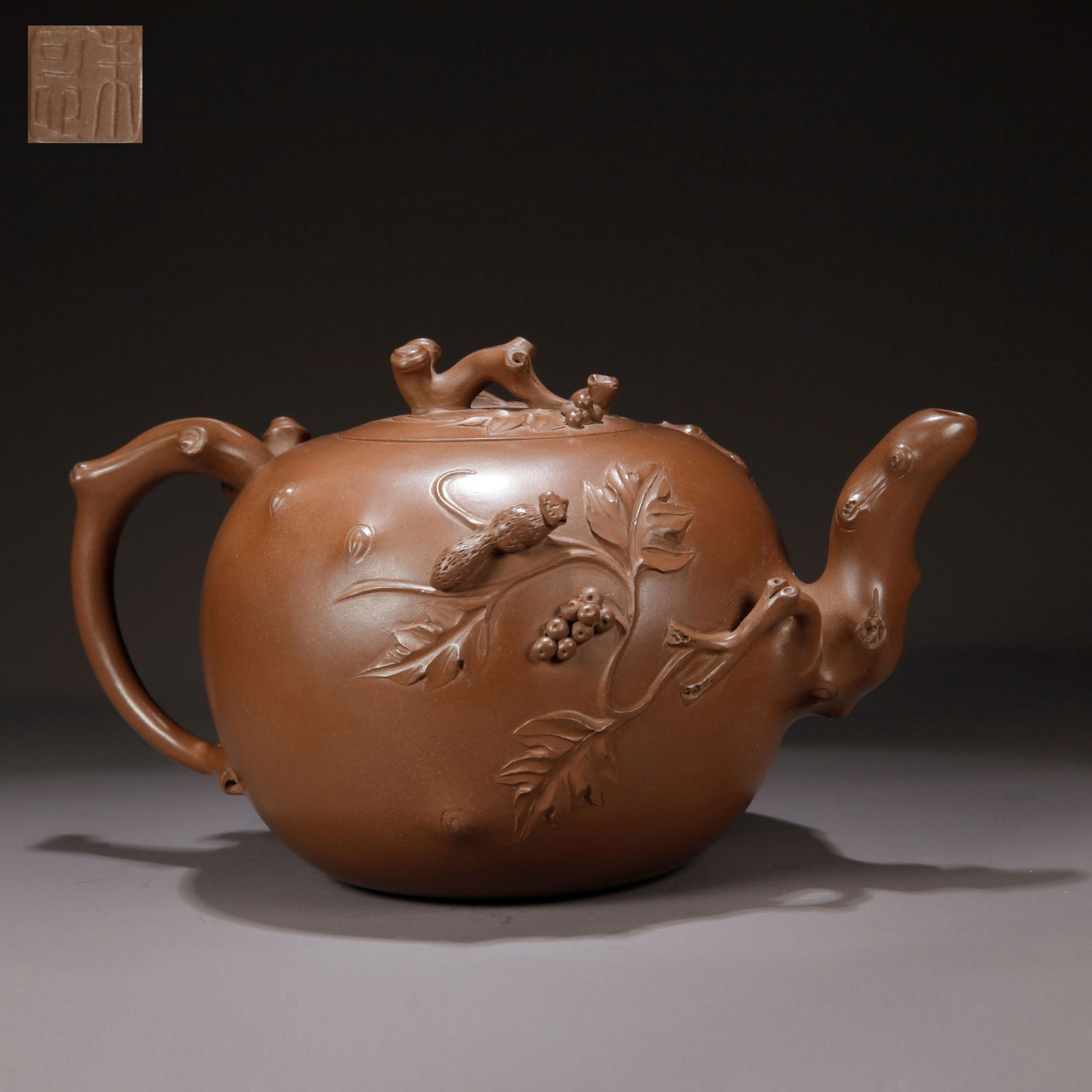 A ZISHA CLAY EWER WITH SQUIRREL AND GRAPE PATTERN: Zisha Clay Ewer with Squirrel and Grape Pattern