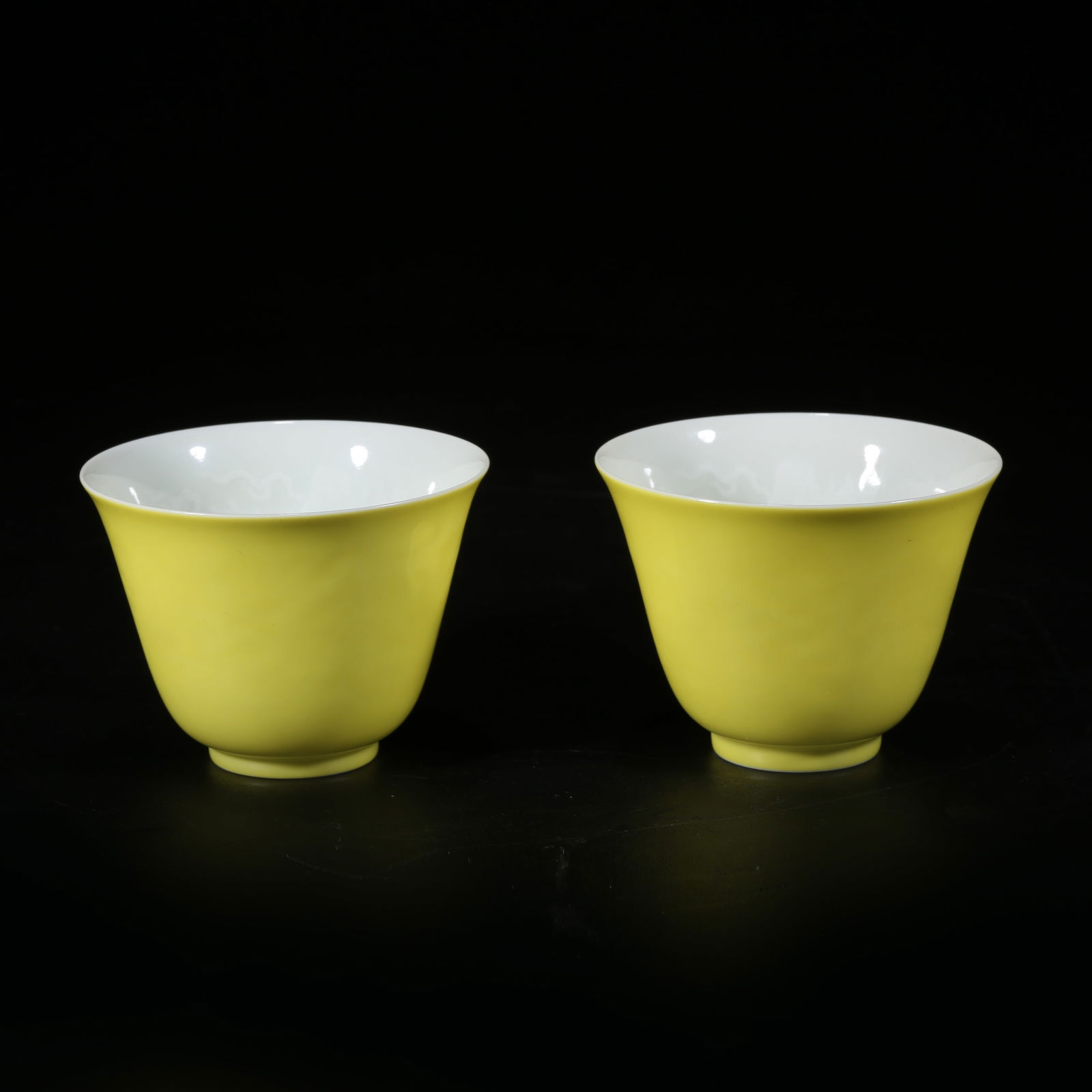 A SET OF LEMON YELLOW GLAZED CUPS: Set of Lemon Yellow Glazed Cups