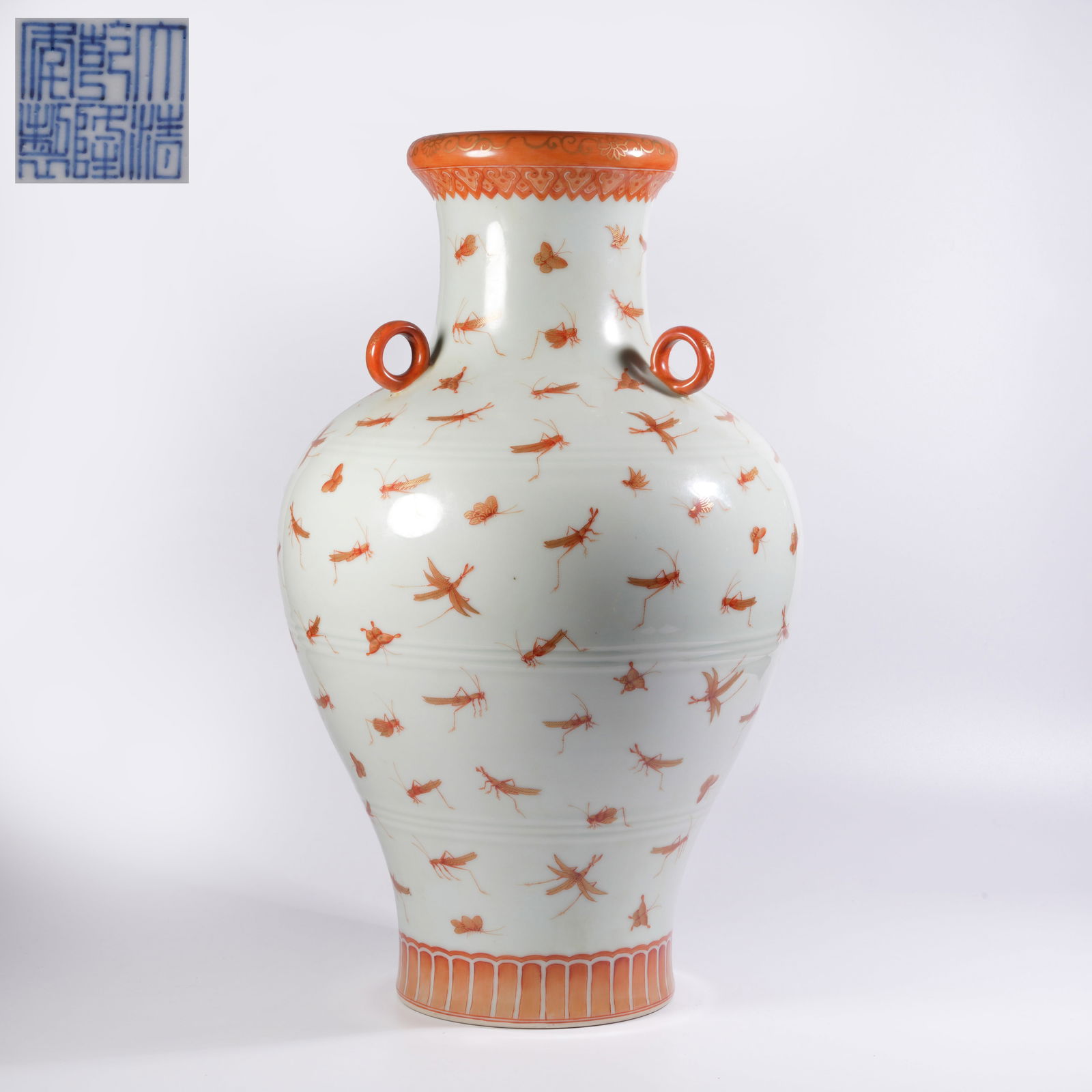 A IRON-RED AND GILT VASE WITH INSECT MOTIFS AND THREE HANDLES: Iron-red and gilt vase with insect motifs and three handles