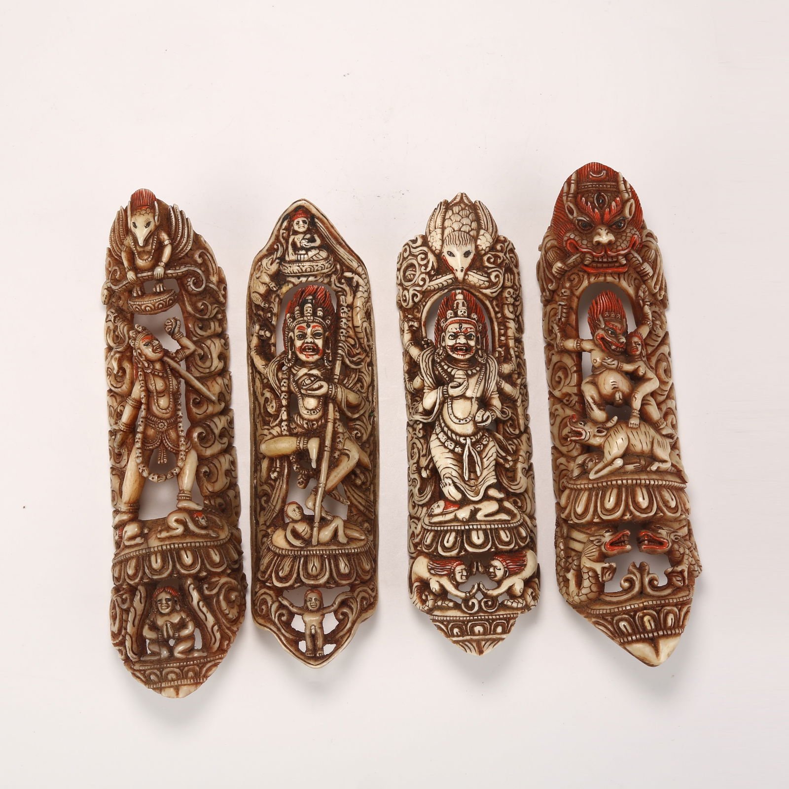 A A GROUP OF BONE-CARVED ROBE FRAGMENTS: A Group of Bone-Carved Robe Fragments