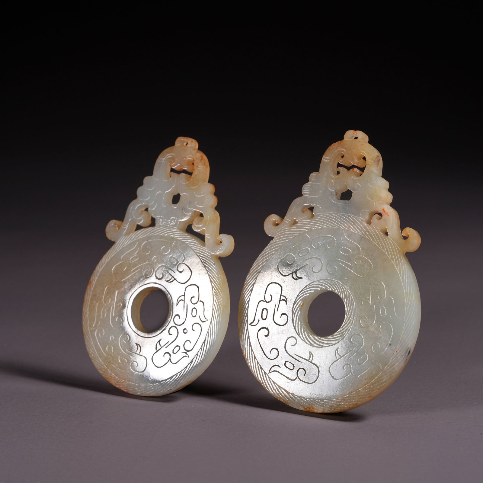 A SET OF HETIAN JADE BI DISCS (1 of 9)