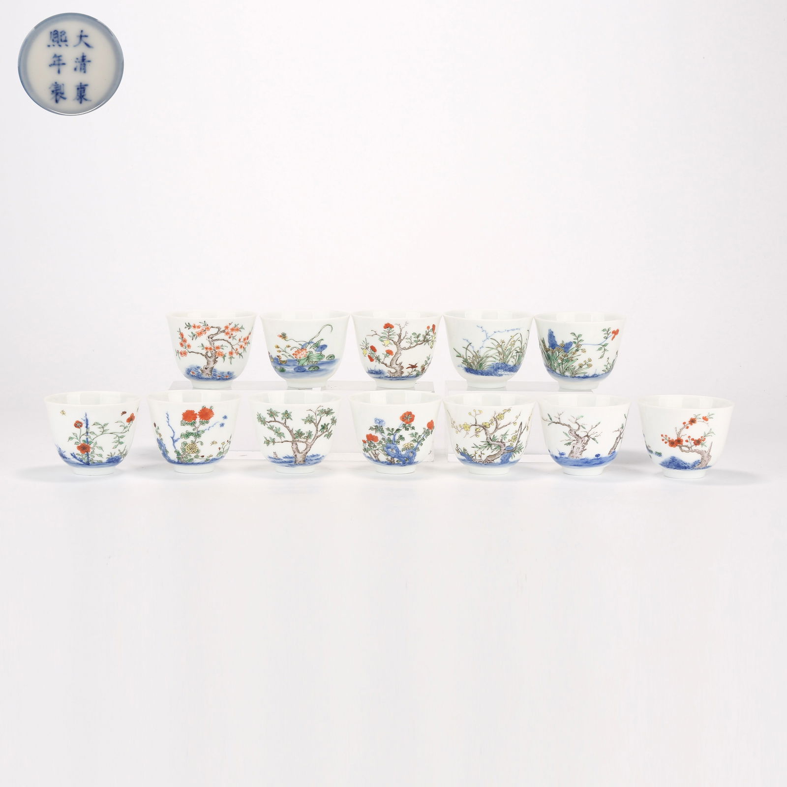 A SET OF WUCAI "TWELVE FLOWER GODS" CUPS: Set of wucai "Twelve Flower Gods" cups