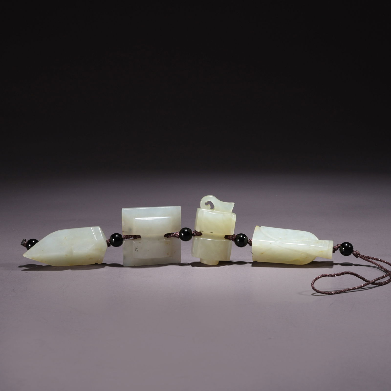 A HETIAN JADE PENDANT WITH PIXIU MOTIF: Hetian Jade Pendant with Pixiu Motif
