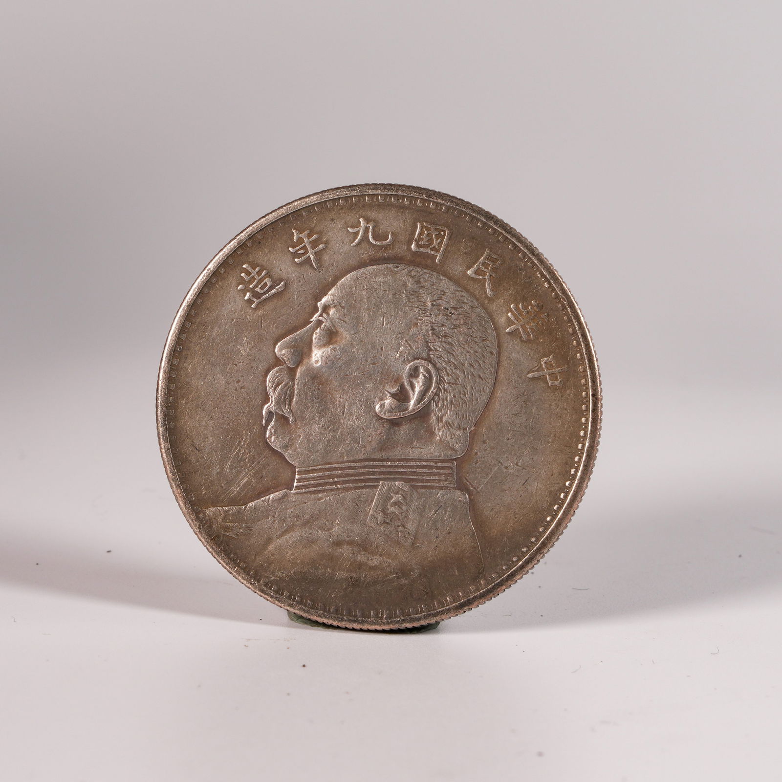 A SILVER DOLLAR COIN (1 of 3)