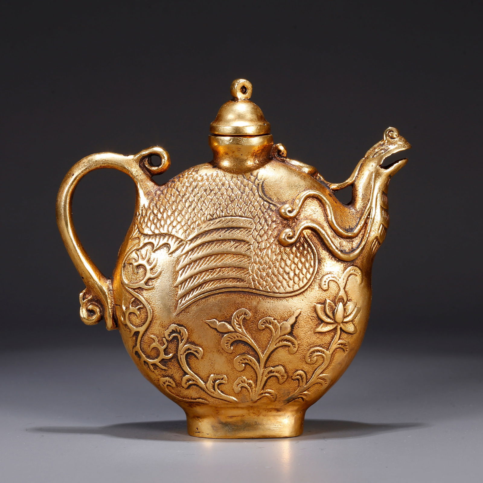 A GILT BRONZE EWER: Gilt bronze ewer