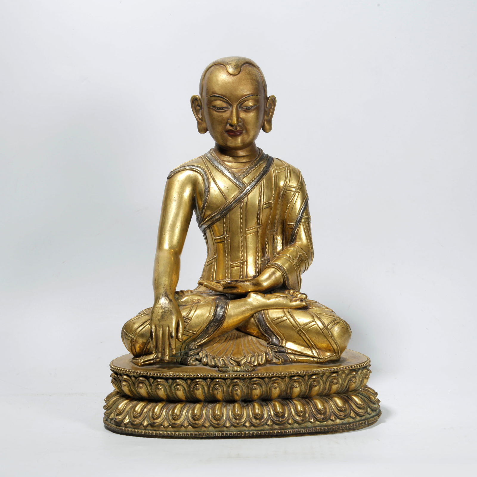 A GILT BRONZE LAMA STATUE: Gilt Bronze Lama Statue
