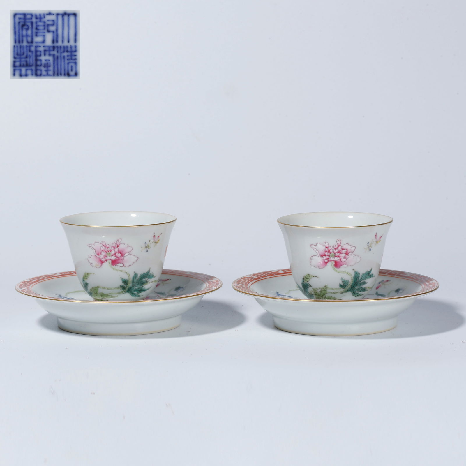 A FAMILLE ROSE TEA CUP WITH FLOWER AND BUTTERFLY DESIGN (PAIR): Famille Rose Tea Cup with Flower and Butterfly Design (Pair)
