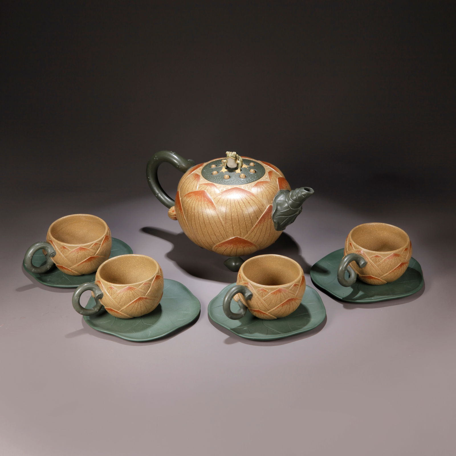 A ZISHA CLAY EWER WITH CARVED LOTUS PATTERN: Zisha Clay Ewer with Carved Lotus Pattern