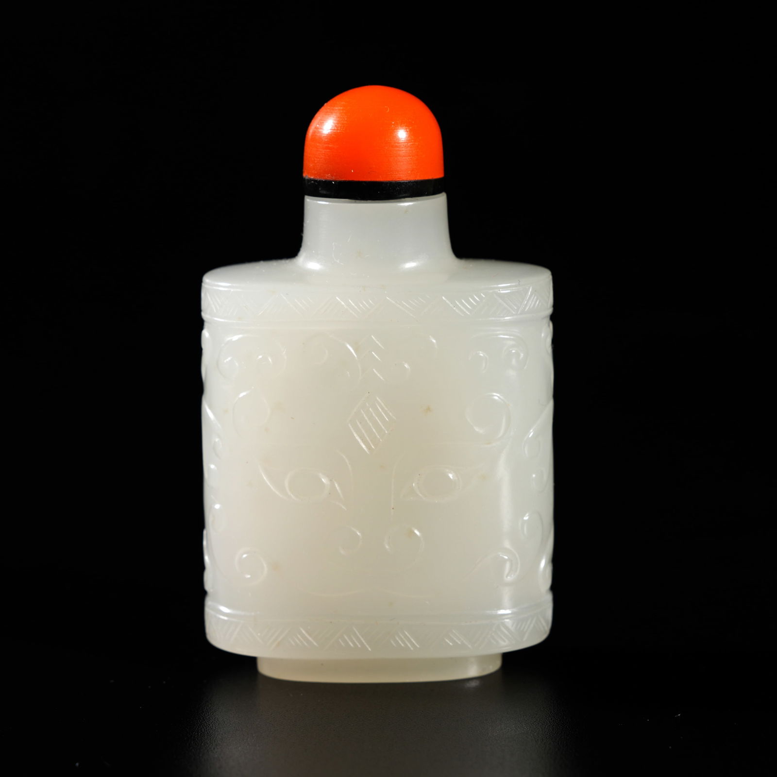 A HETIAN JADE CARVED BEAST-MASK-MOTIF SNUFF BOTTLE: Hetian Jade Carved Beast-Mask-Motif Snuff Bottle