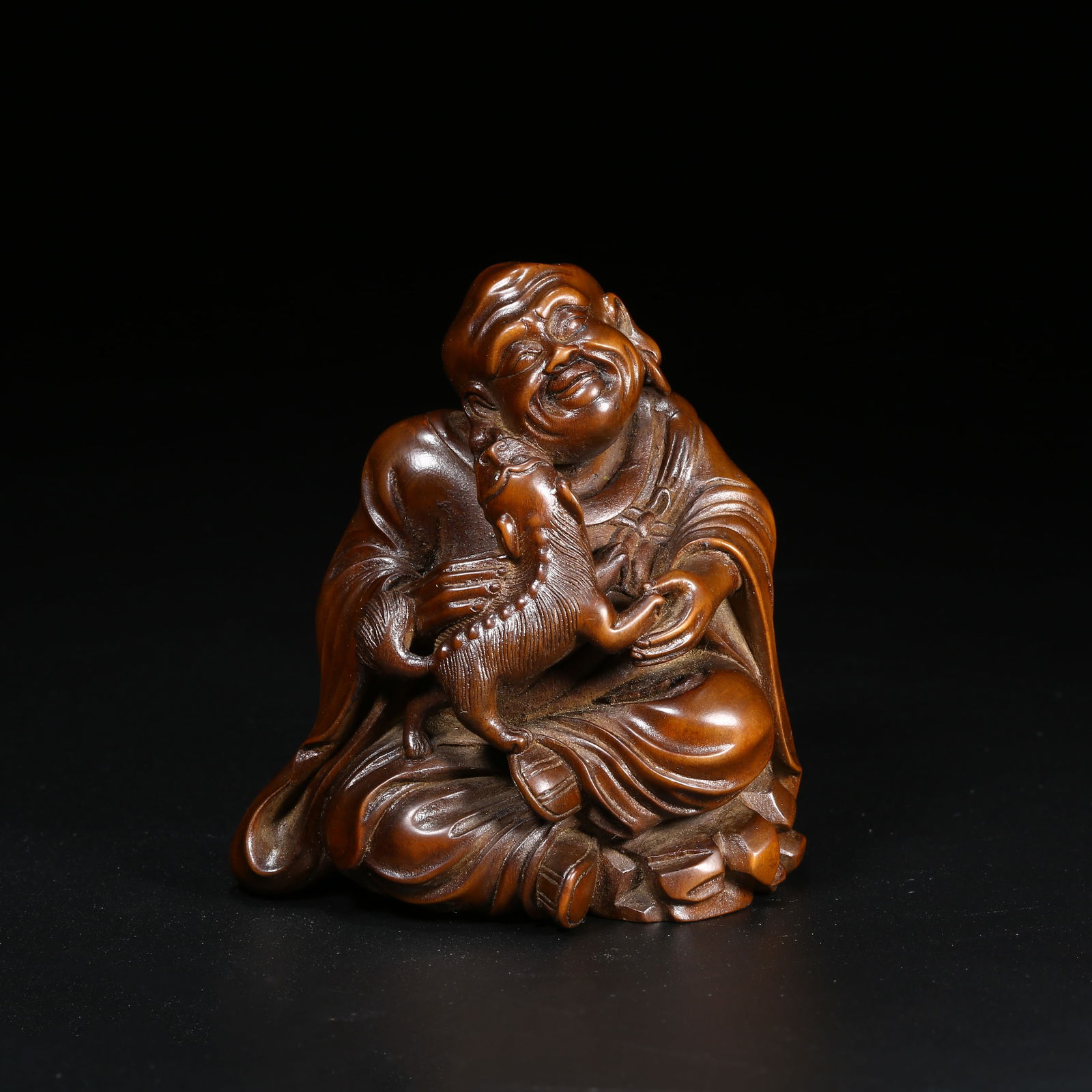 A BOXWOOD FIGURE OF ARHAT: Boxwood figure of Arhat