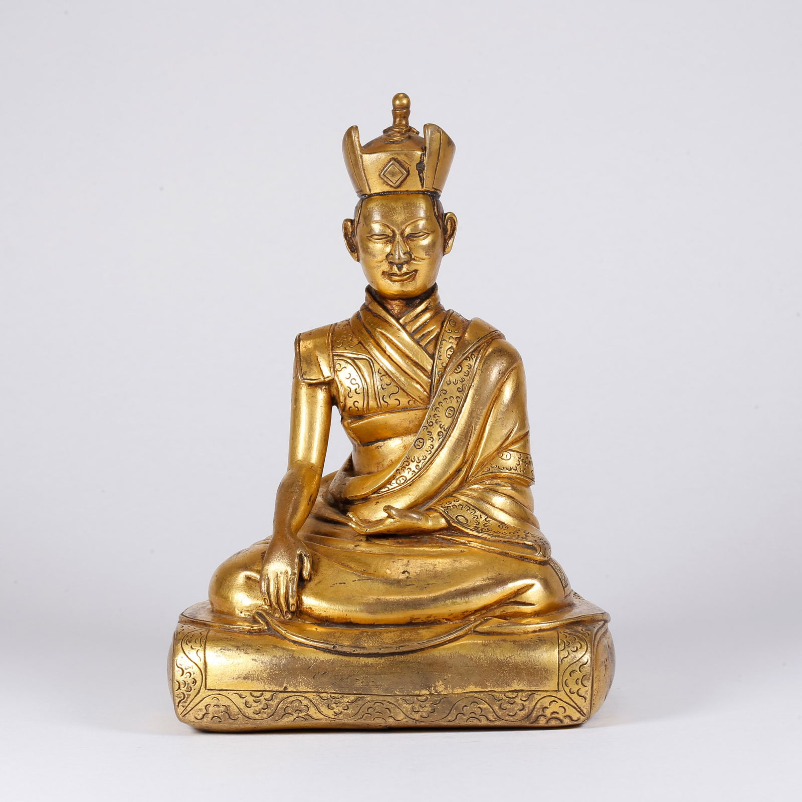 A GILT BRONZE LAMA STATUE: Gilt Bronze Lama Statue