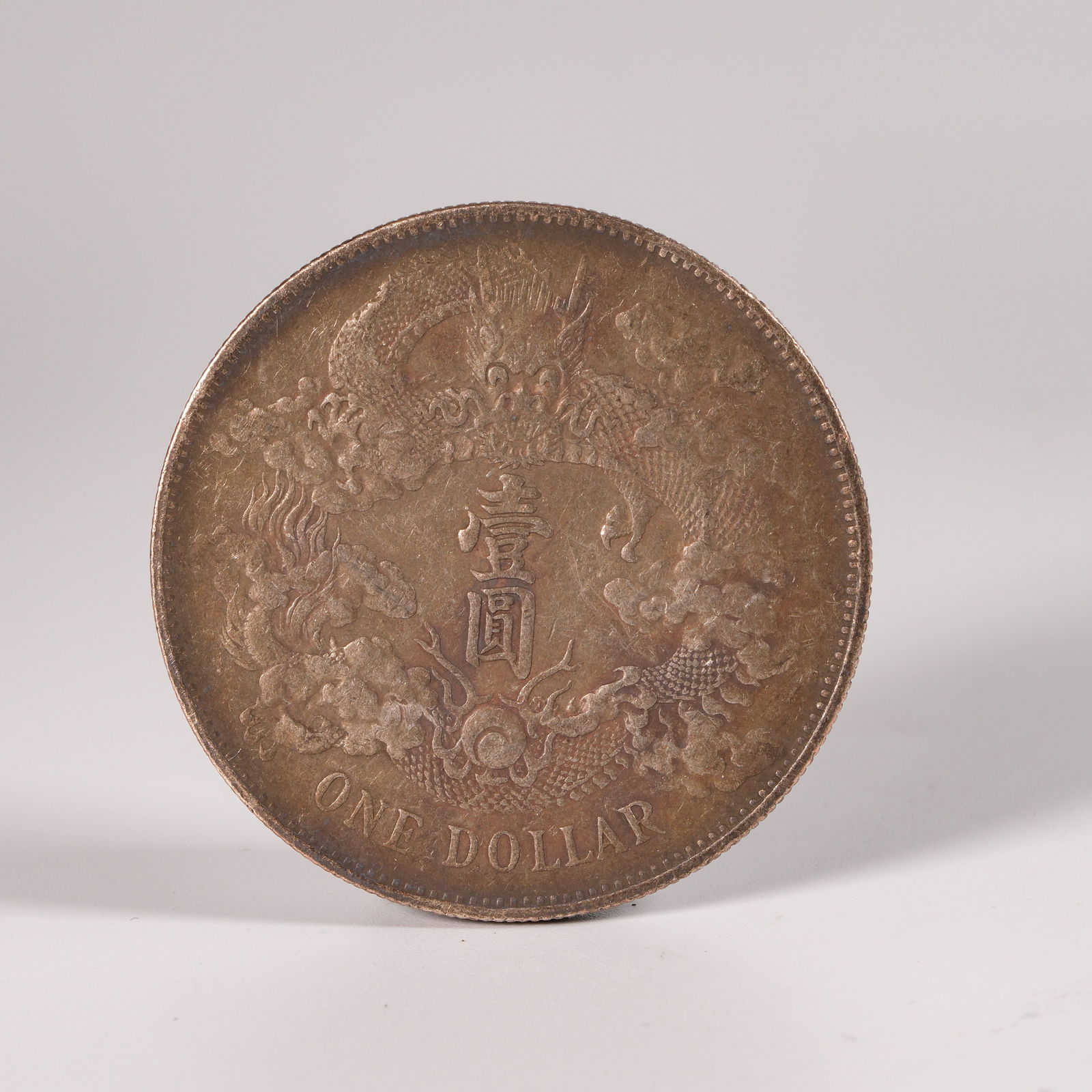 A SILVER DOLLAR COIN - 3