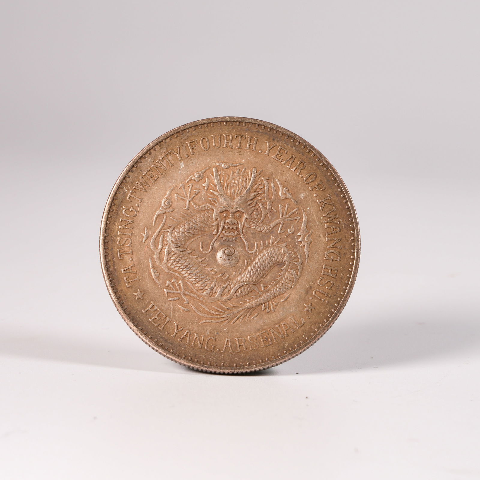 A SILVER DOLLAR COIN - 3