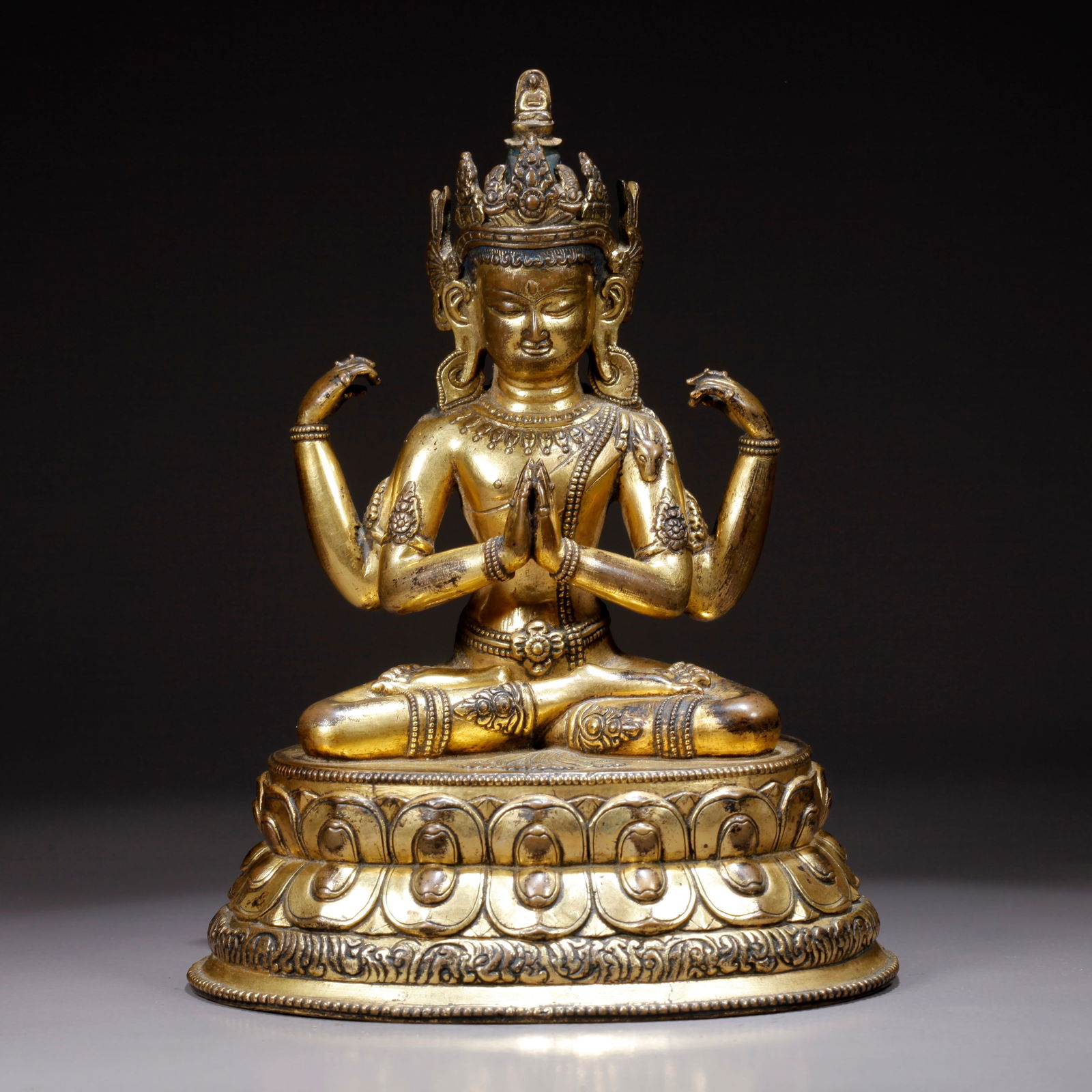 A GILDED BRONZE FOUR-ARMED AVALOKITESHVARA STATUE: Gilded Bronze Four-Armed Avalokiteshvara Statue