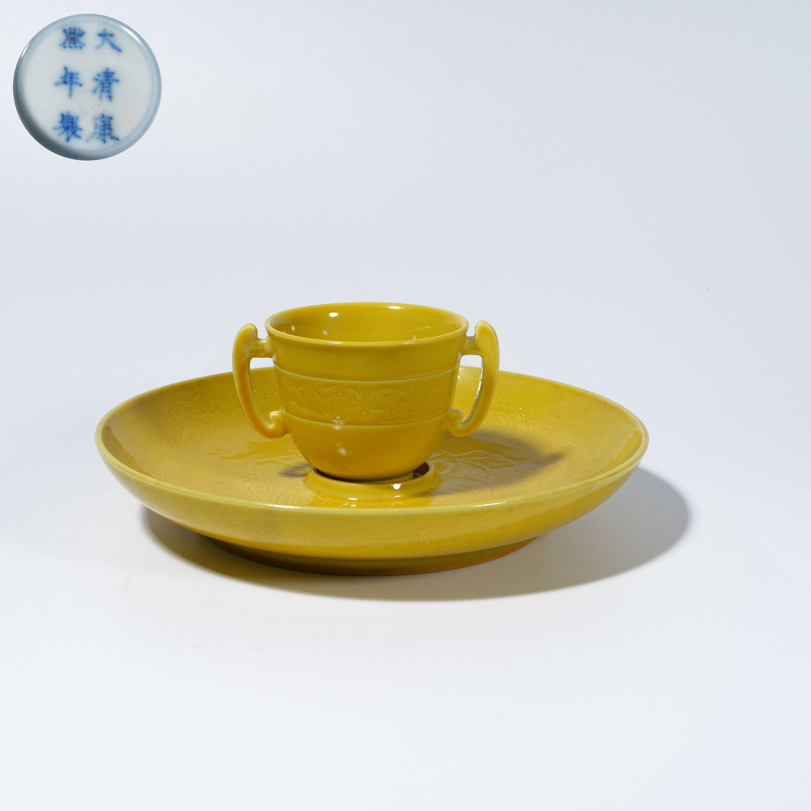 A YELLOW-GLAZED TEA BOWL WITH INCISED DOUBLE-DRAGON PLAYING PEARL MOTIF: Yellow-Glazed Tea Bowl with Incised Double-Dragon Playing Pearl Motif