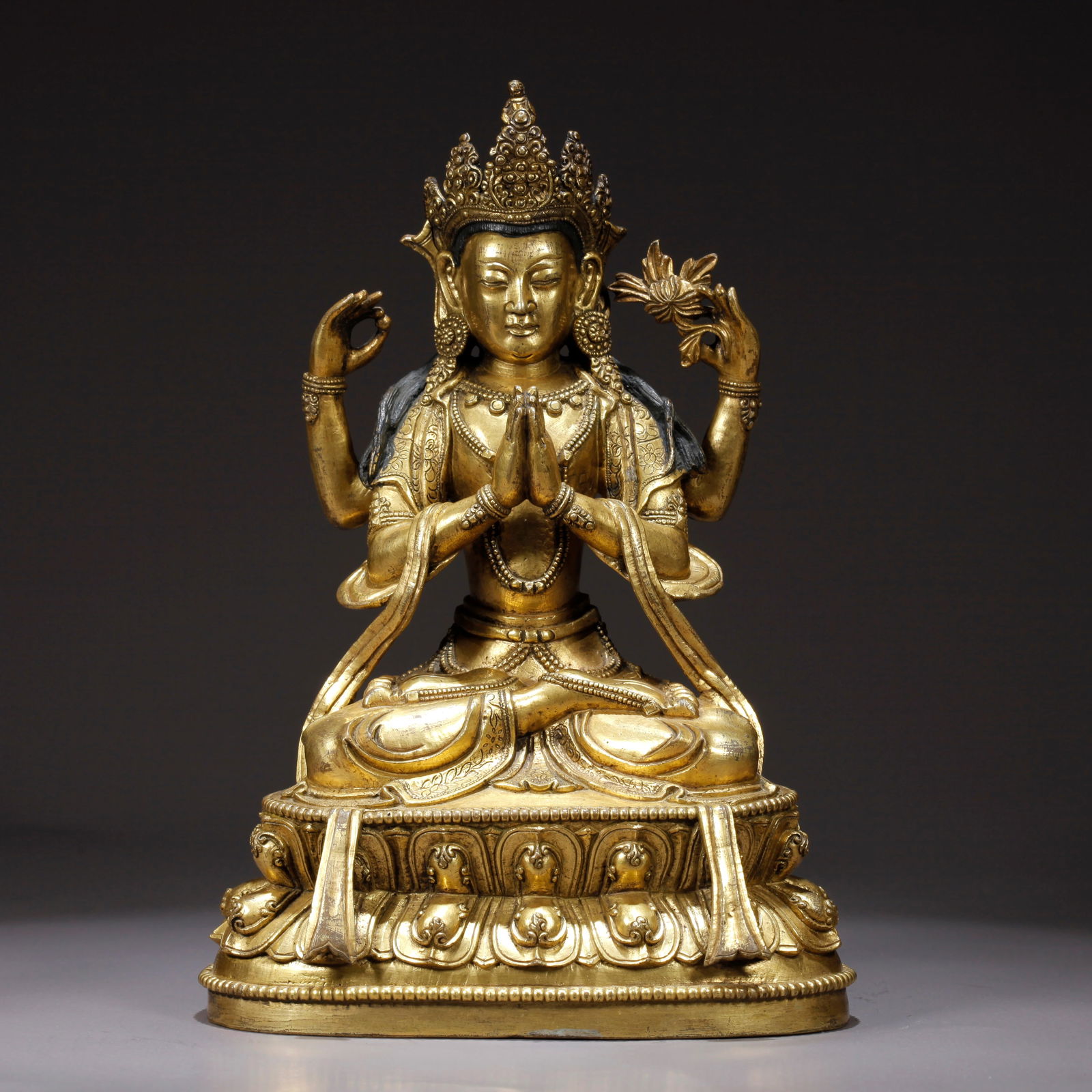 A GILDED BRONZE FOUR-ARMED AVALOKITESHVARA STATUE: Gilded Bronze Four-Armed Avalokiteshvara Statue