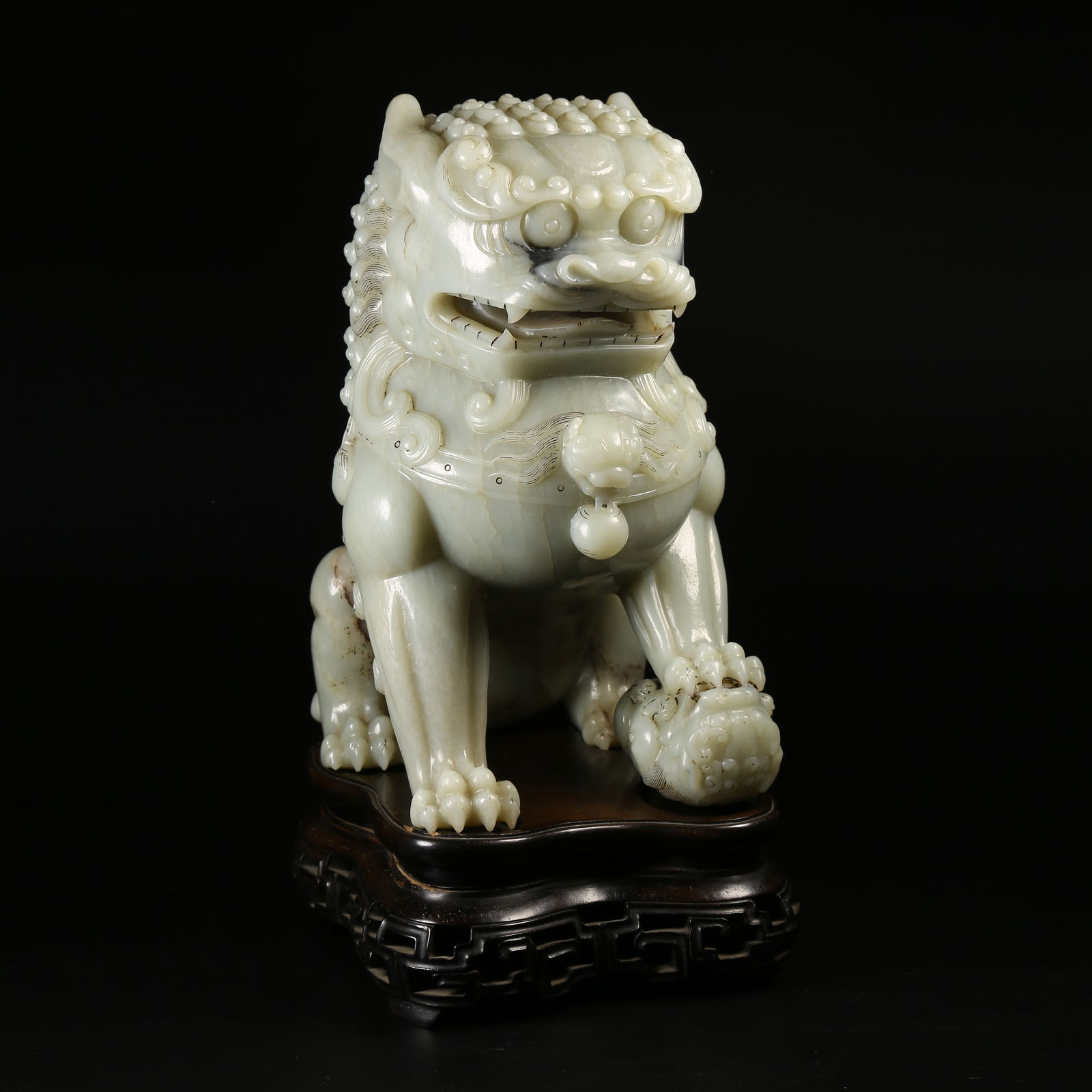 A HETIAN JADE AUSPICIOUS LION FIGURINE (1 of 9)