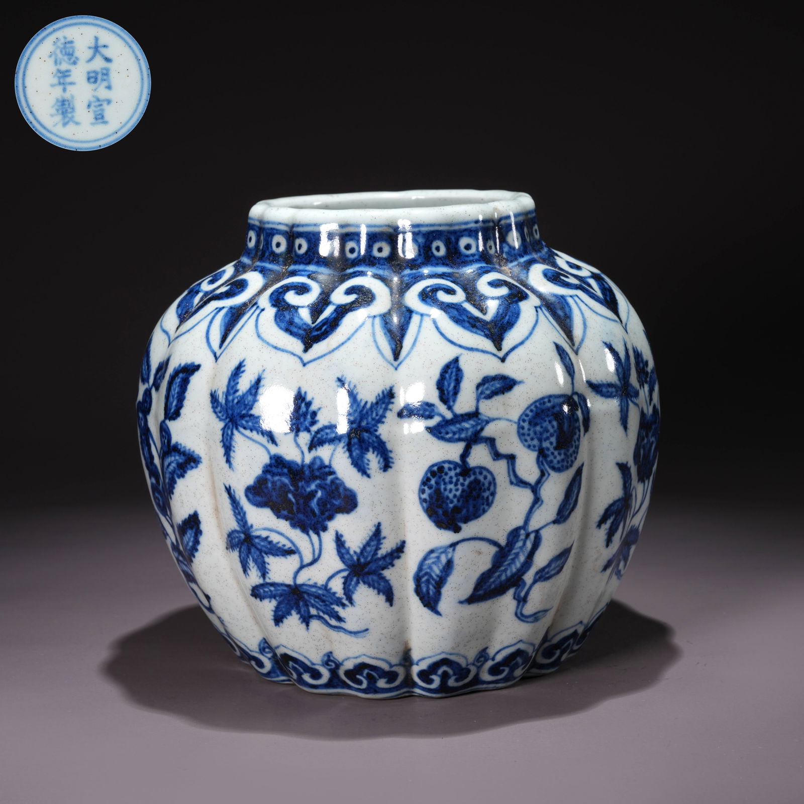 A BLUE-AND-WHITE JAR WITH MELON AND FRUIT MOTIFS: Blue-and-White Jar with Melon and Fruit Motifs