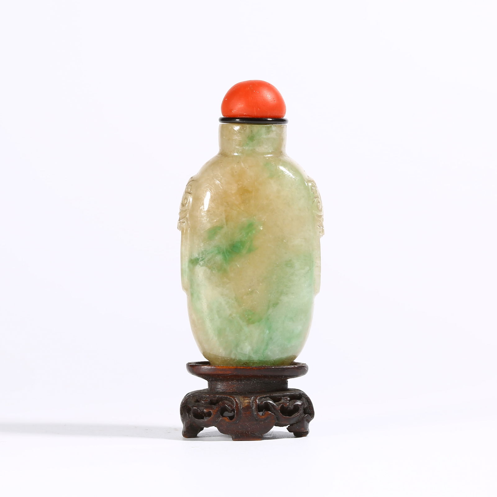 A JADEITE SNUFF BOTTLE WITH ANIMAL-MASK HANDLES: Jadeite snuff bottle with animal-mask handles