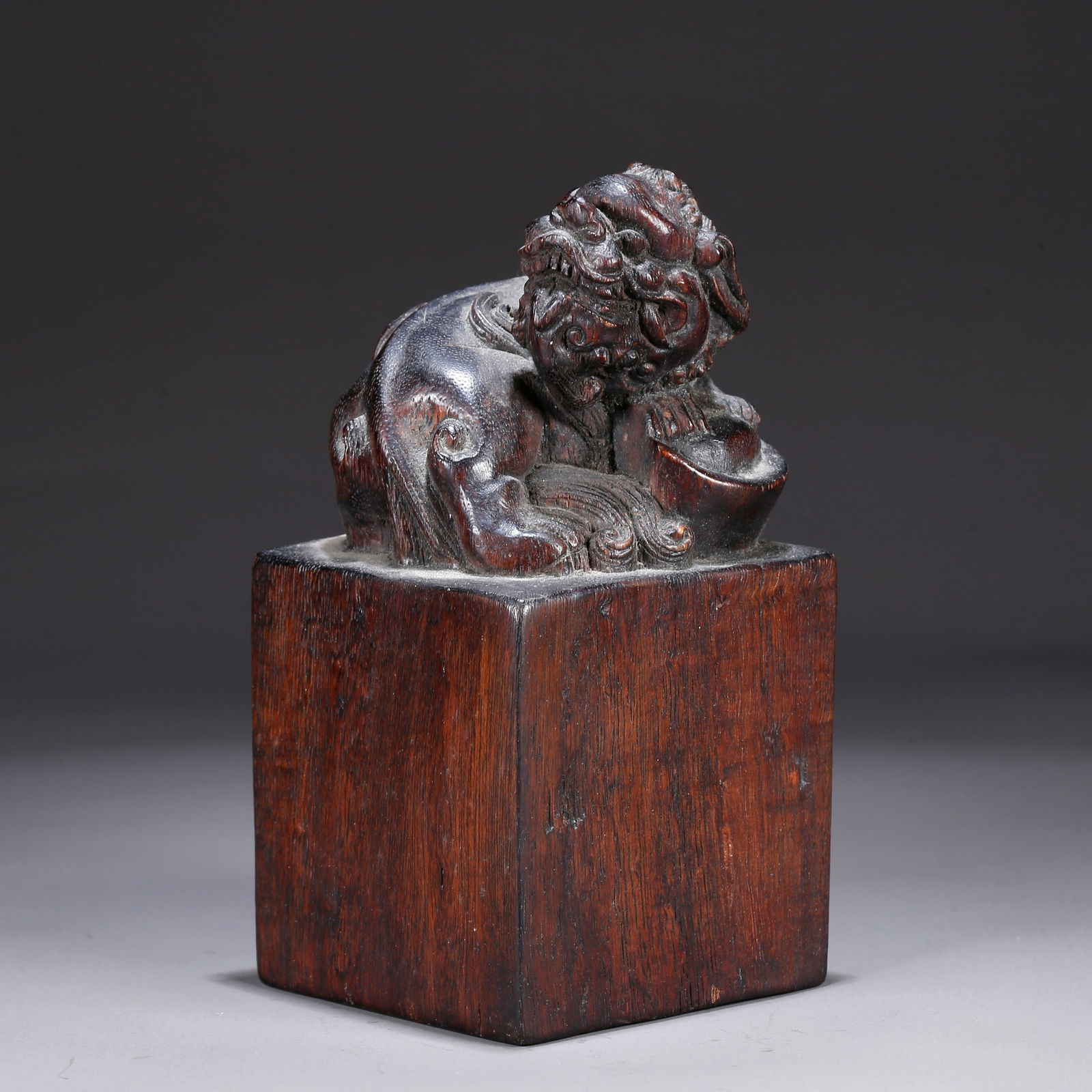 A SANDALWOOD CARVING OF A LION-KNOB SEAL: Sandalwood carving of a lion-knob seal