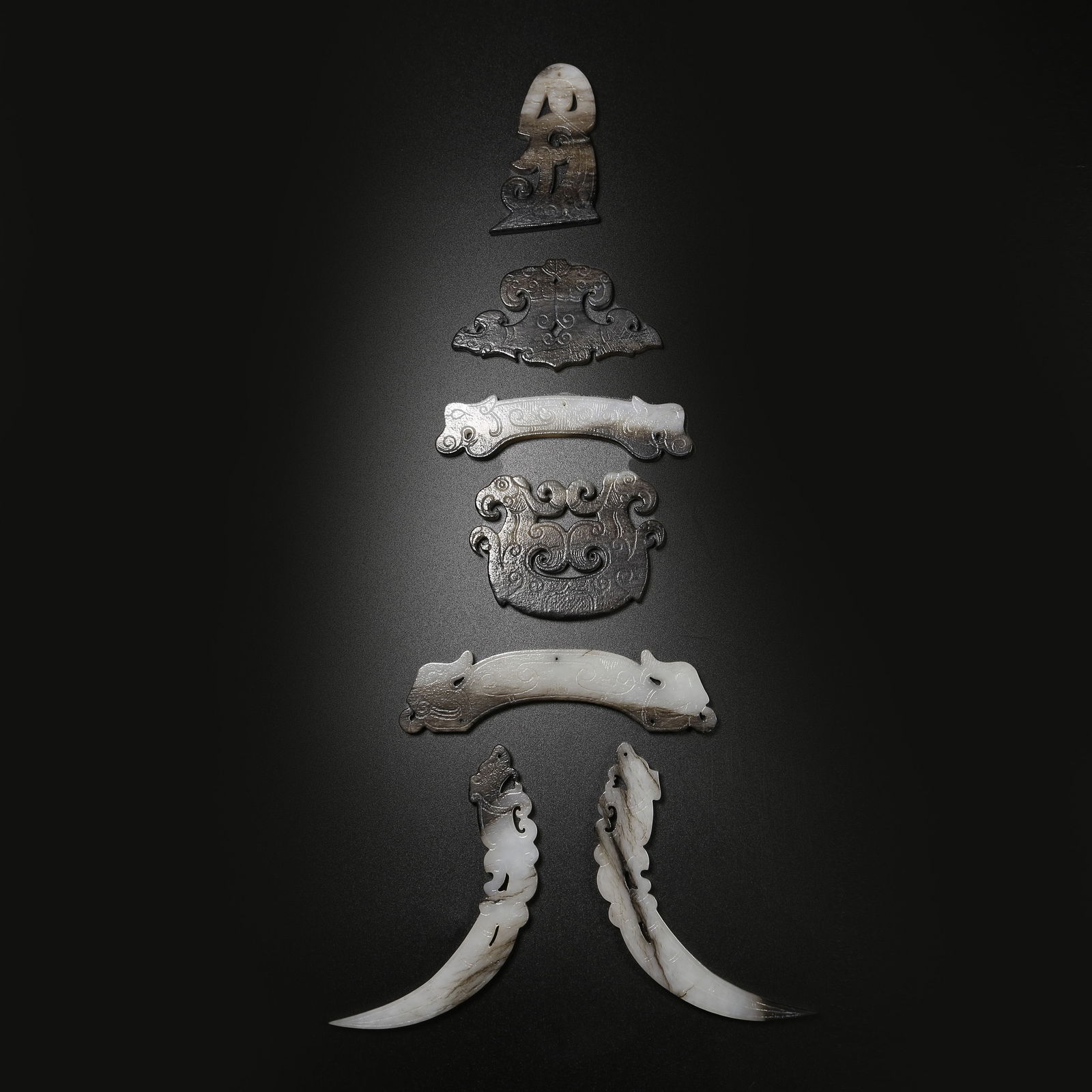 A ANCIENT JADE DANCING FIGURES PENDANT SET: Ancient Jade Dancing Figures Pendant Set