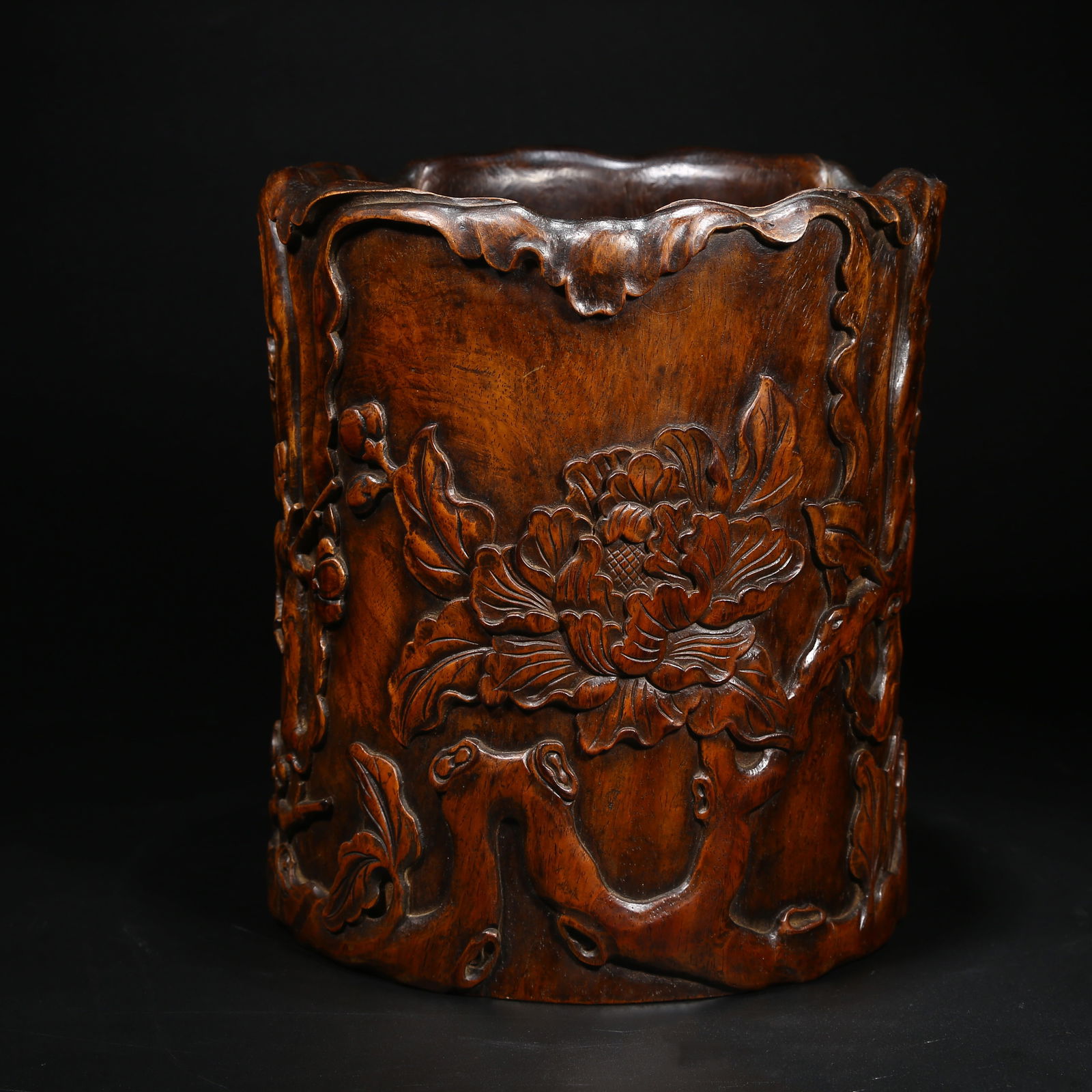 A HUANGHUALI WOOD BRUSH POT WITH FLOWER MOUTH AND FLORAL DESIGN: Huanghuali wood brush pot with flower mouth and floral design